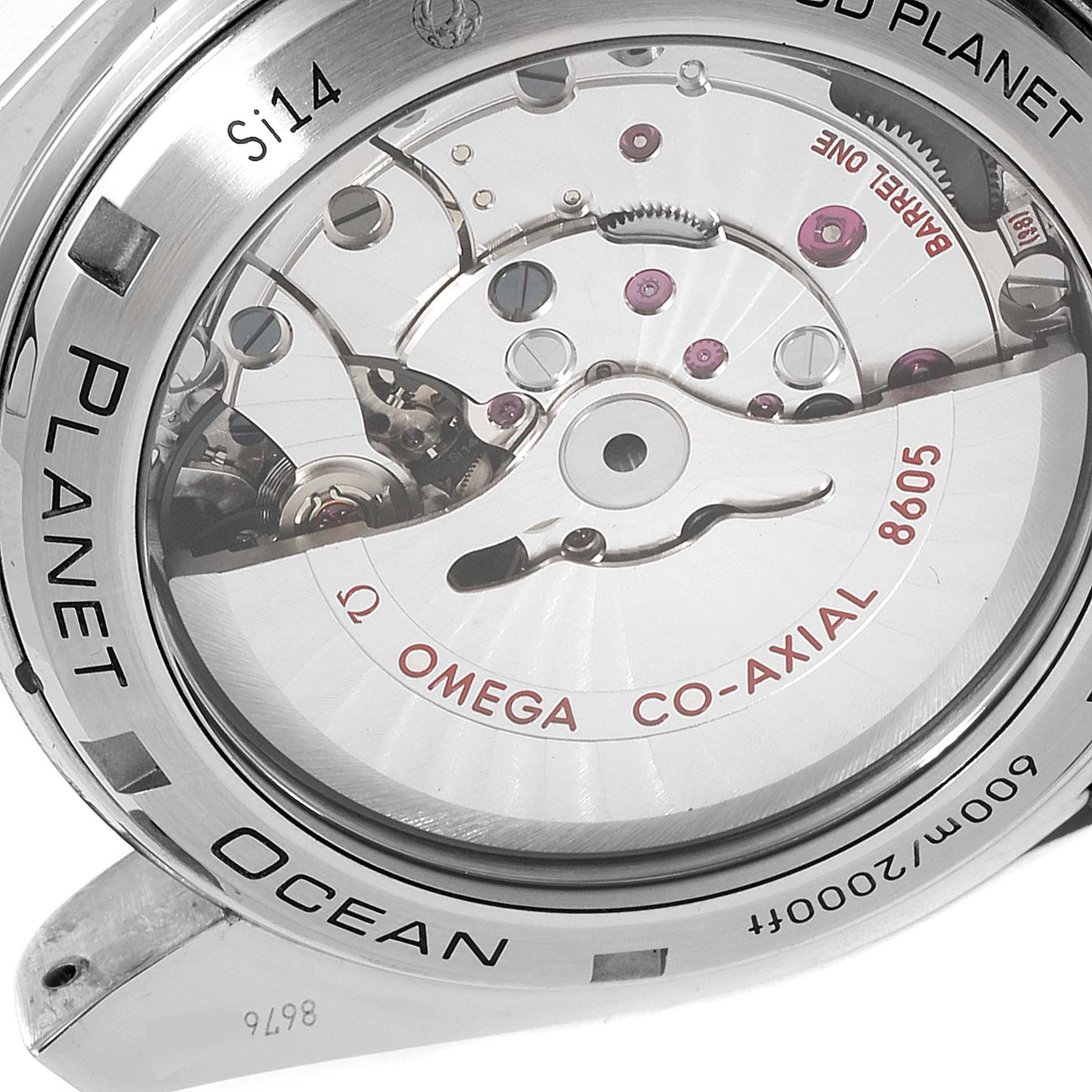 The image shows a close-up of the movement mechanism and back case of the Omega Planet Ocean 232.30.44.22.03.001 Men's Stainless Steel Blue Dial 232.30.44.22.03.001 Men's Stainless Steel Blue Dial watch.