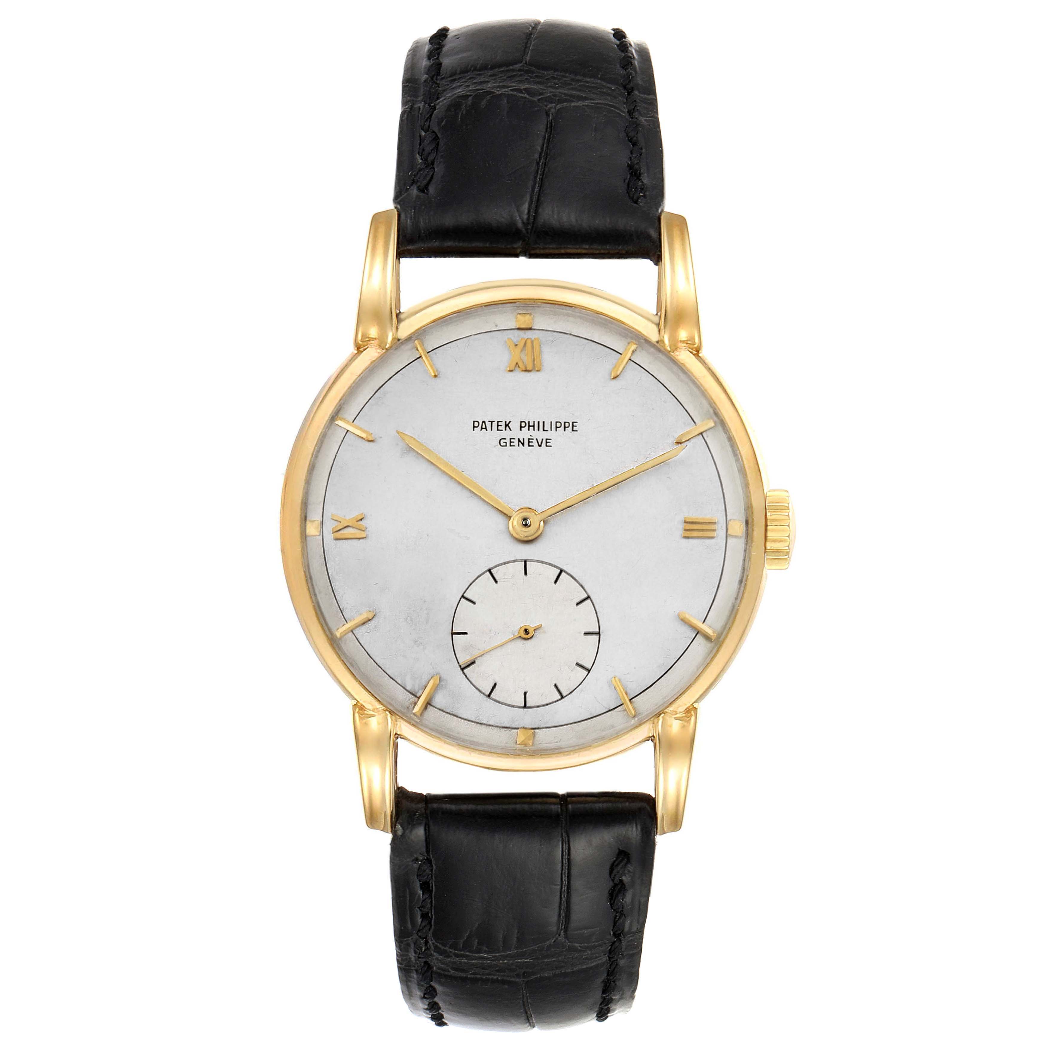 The image shows a front angle of a Vintage Patek Philippe watch, highlighting its face, gold casing, and black leather strap.