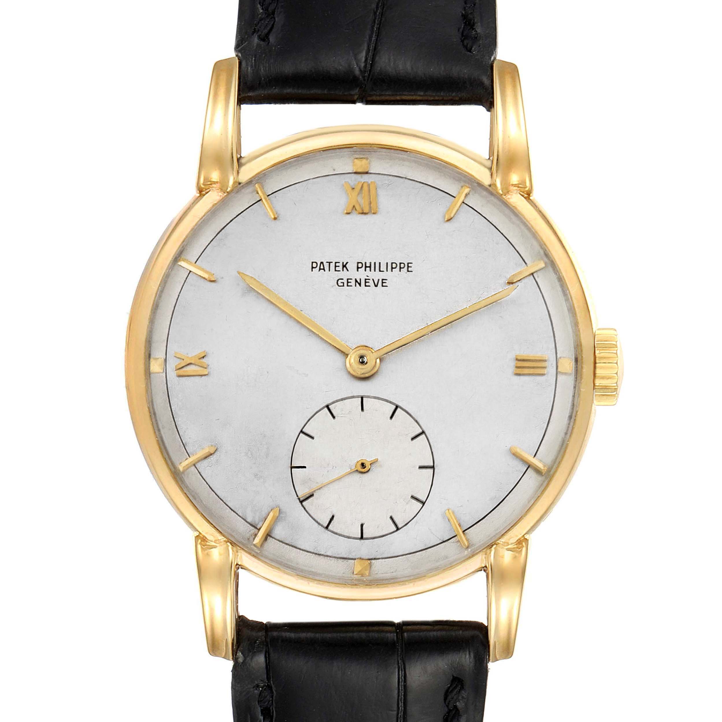 This is a front view of a Patek Philippe Calatrava 2430 Men's Yellow Gold Silver Dial 2430 Men's Yellow Gold Silver Dial watch, showing the face, hands, bezel, lugs, and part of the leather strap.