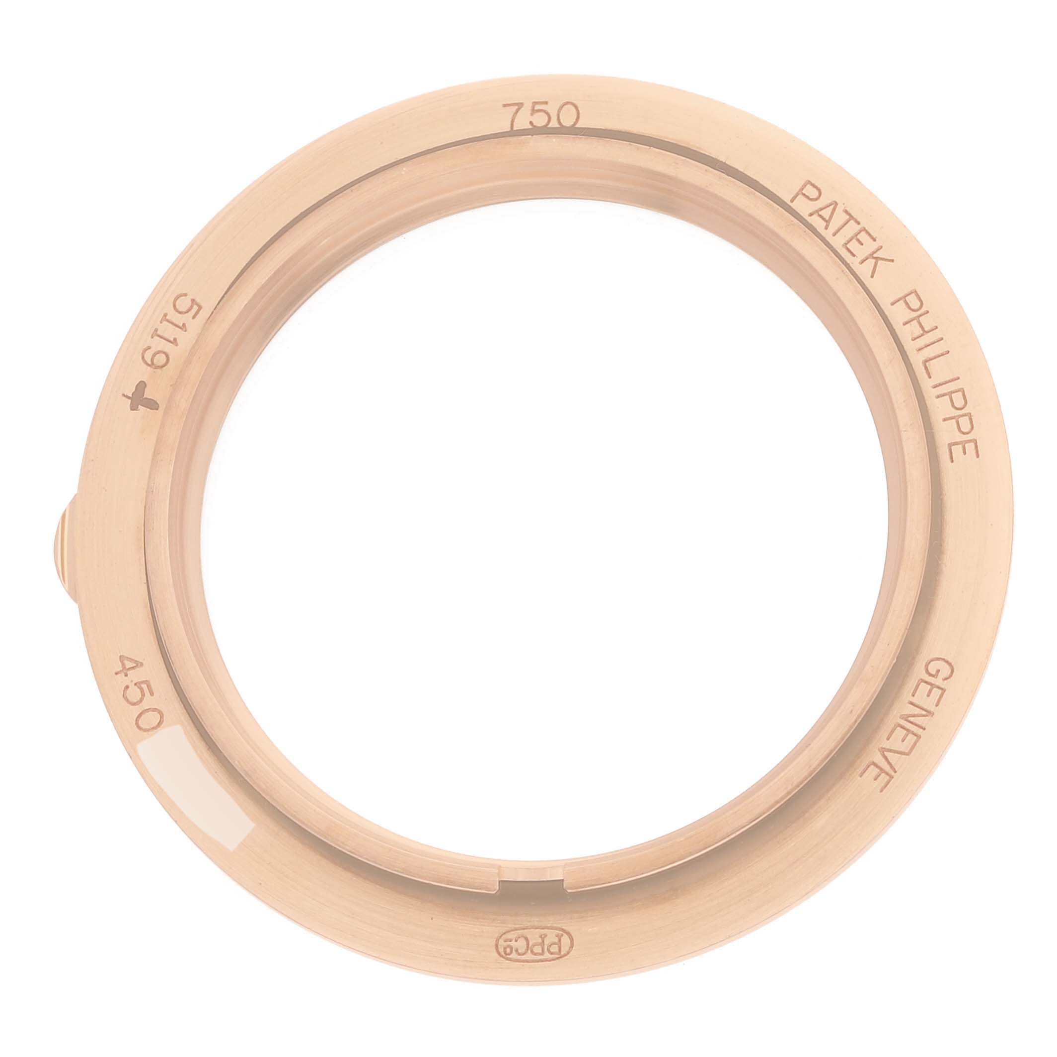 The image shows a bezel of a Patek Philippe Calatrava 5119R Men's Rose Gold White Dial 5119R Men's Rose Gold White Dial watch viewed from the front.