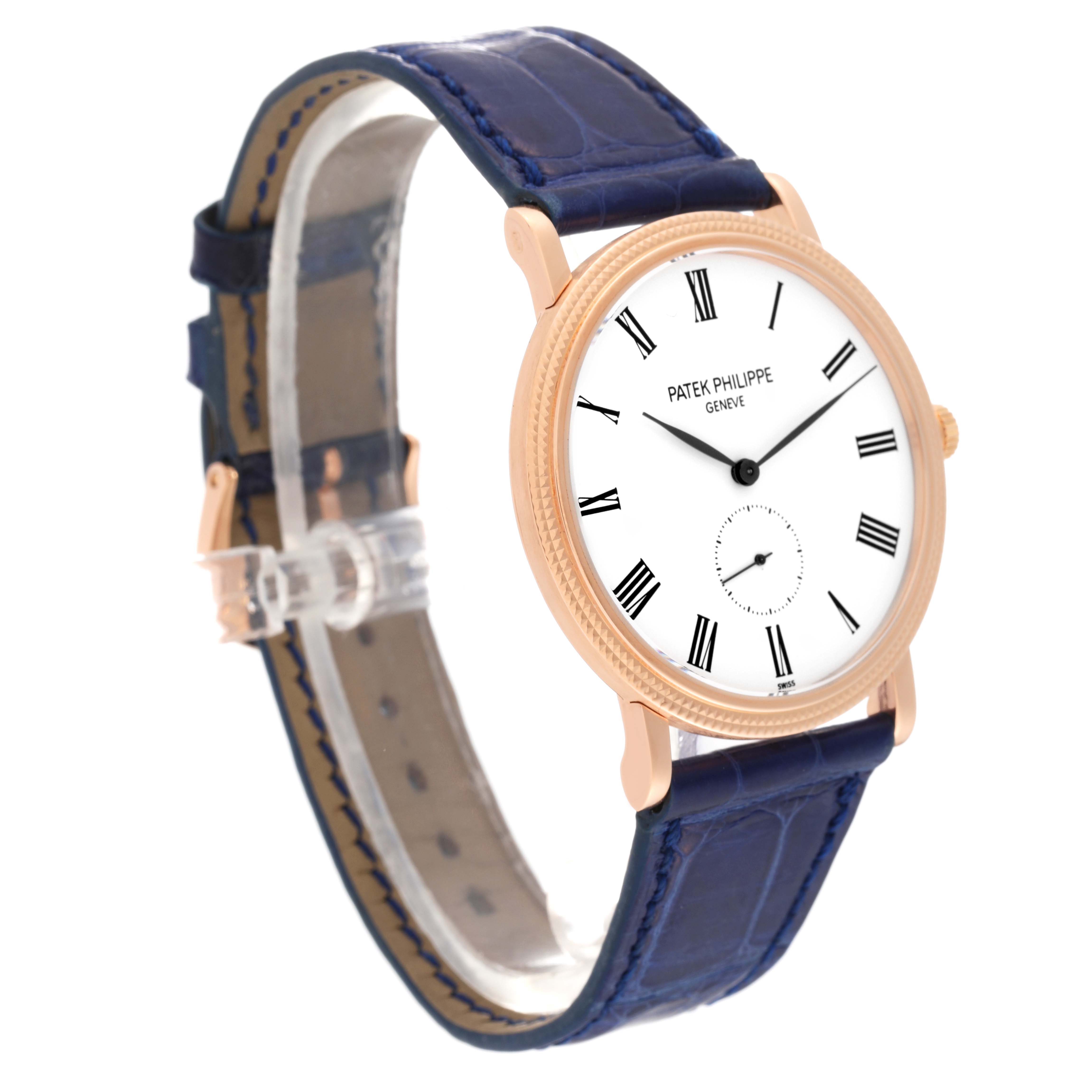 The image shows a side angle of the Patek Philippe Calatrava 5119R Men's Rose Gold White Dial 5119R Men's Rose Gold White Dial watch, highlighting its white dial, gold case, and blue leather strap.