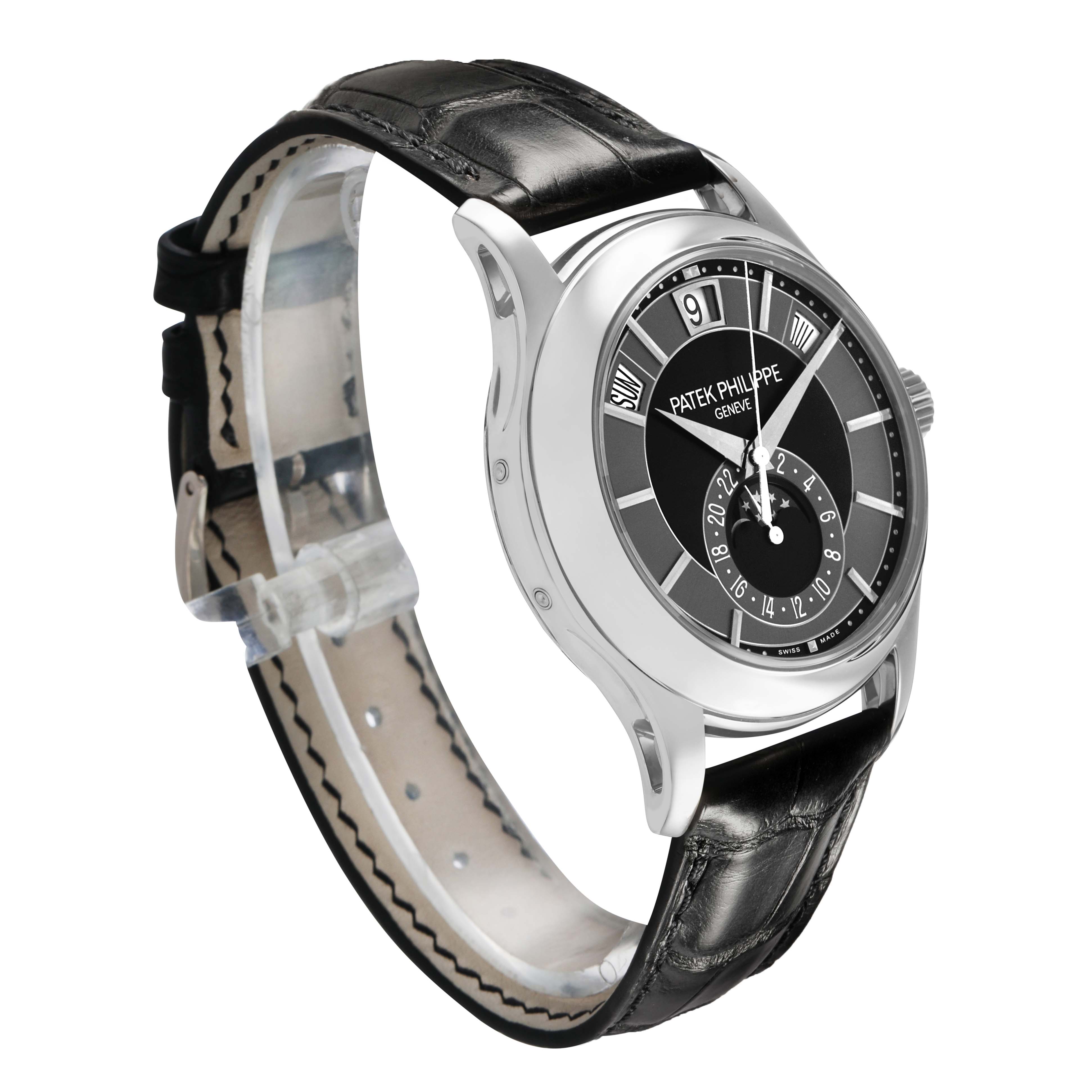 The Patek Philippe Complications 5205G-010 Men's White Gold Grey Dial watch is shown at a three-quarter angle, highlighting its dial, side profile, and leather strap.