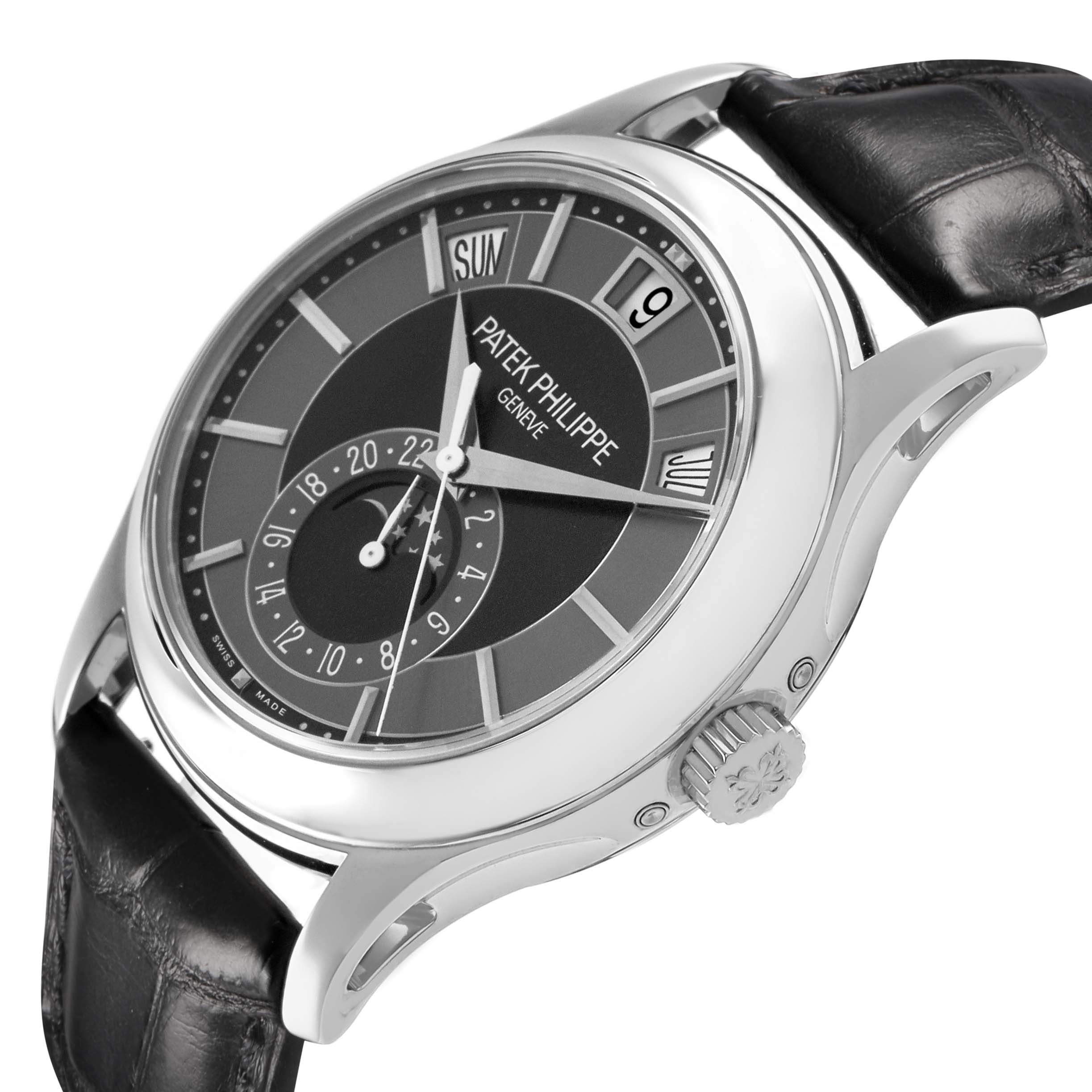 The Patek Philippe Complications 5205G-010 Men's White Gold Grey Dial watch is shown from a three-quarter angle, highlighting its dial, crown, and leather strap.