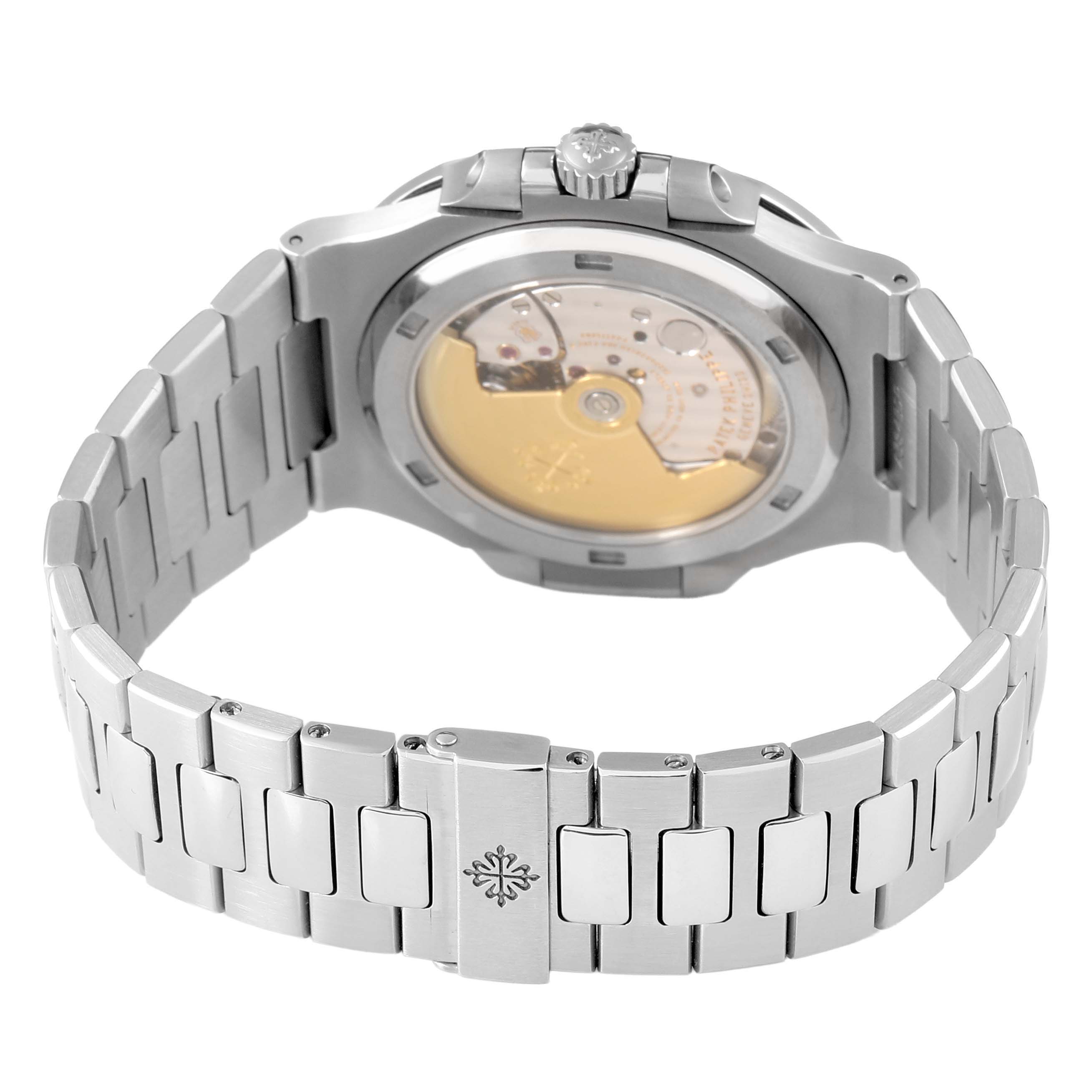 The image shows the back of a Patek Philippe Nautilus 5711/1A-001 Men's Stainless Steel Blue Dial watch, highlighting its movement and the metal bracelet clasp.