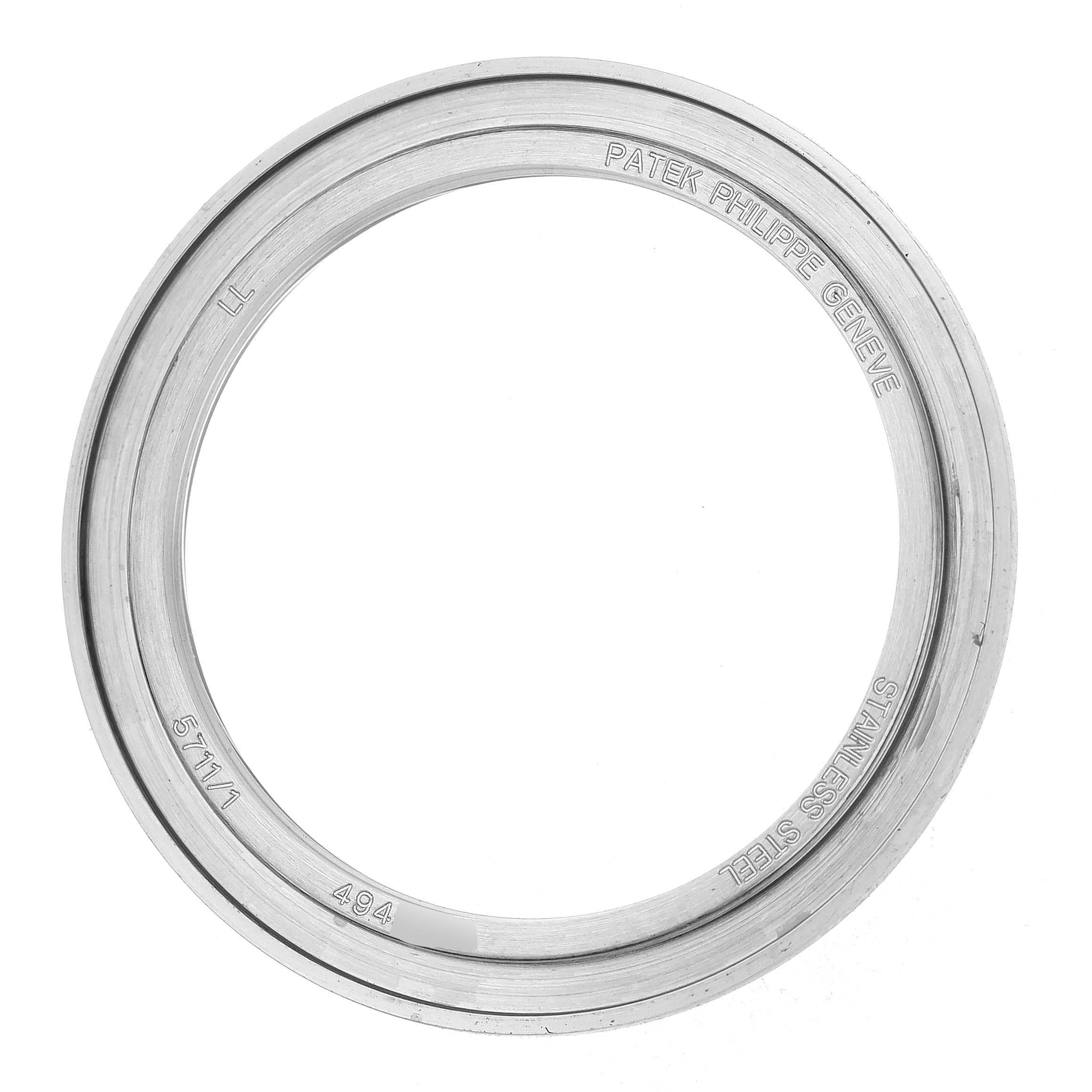 The image shows the stainless steel bezel of a Patek Philippe Nautilus 5711/1A-001 Men's Stainless Steel Blue Dial watch from a top view.