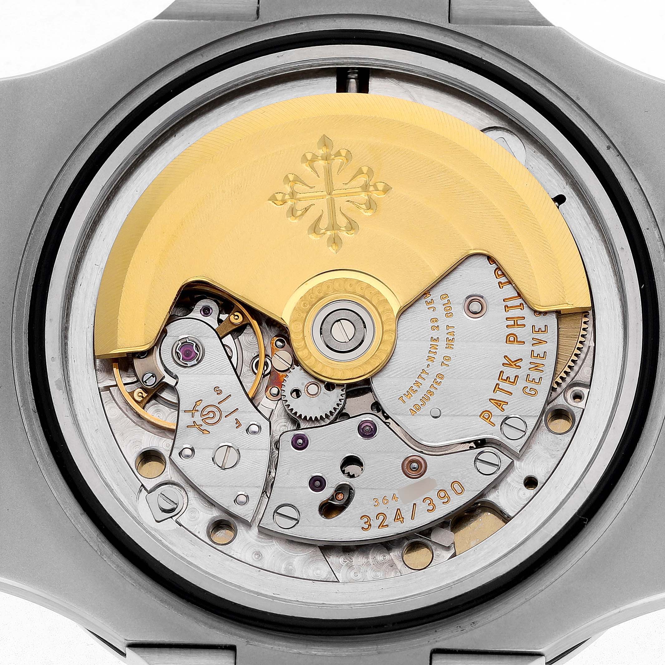 The image shows the back view of the Patek Philippe Nautilus 5711/1A-001 Men's Stainless Steel Blue Dial watch, highlighting its intricate movement and rotor.