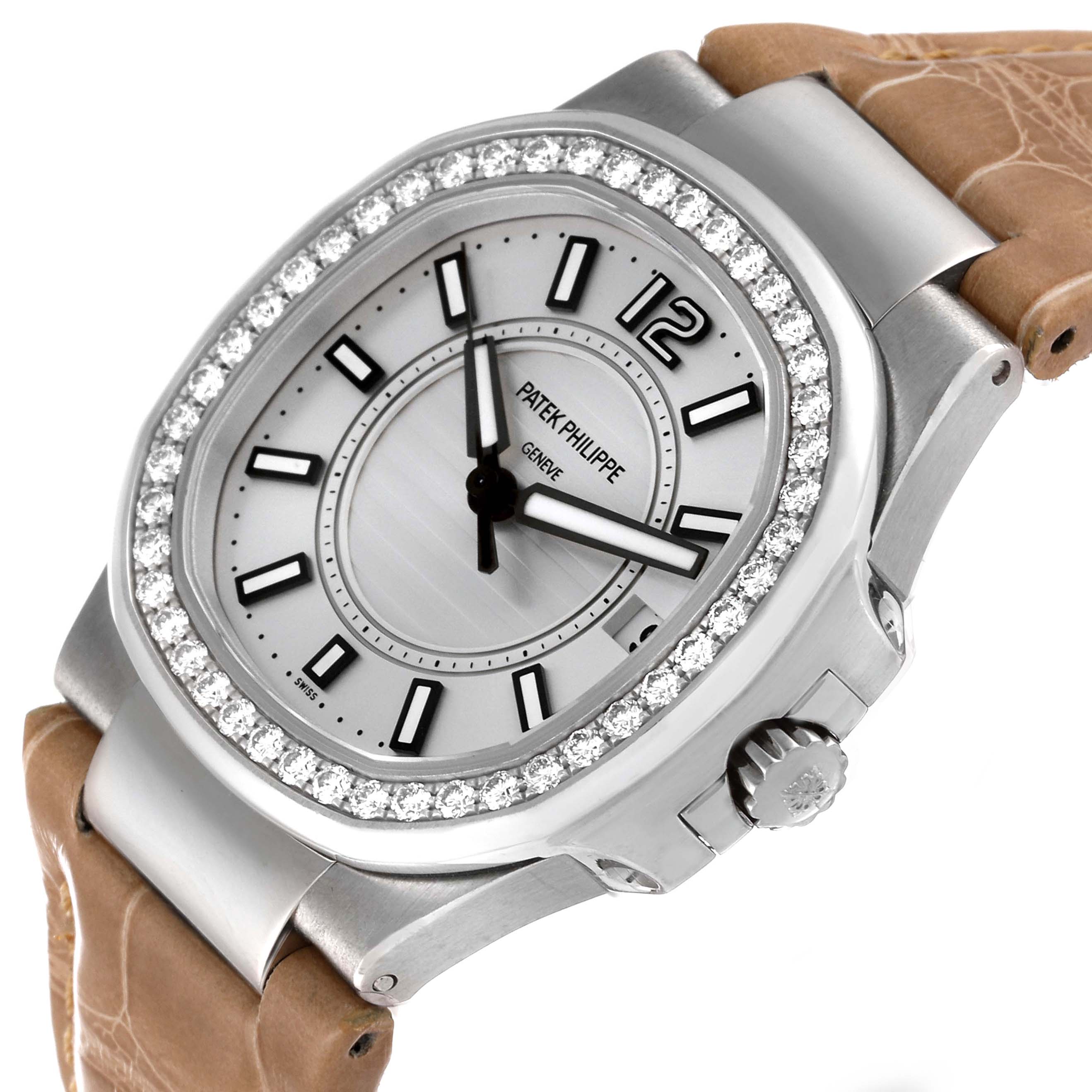 The image shows a close-up angled view of a Patek Philippe Nautilus 7010G Women's White Gold Silver Dial 7010G Women's White Gold Silver Dial watch face, bezel, and part of the leather strap.