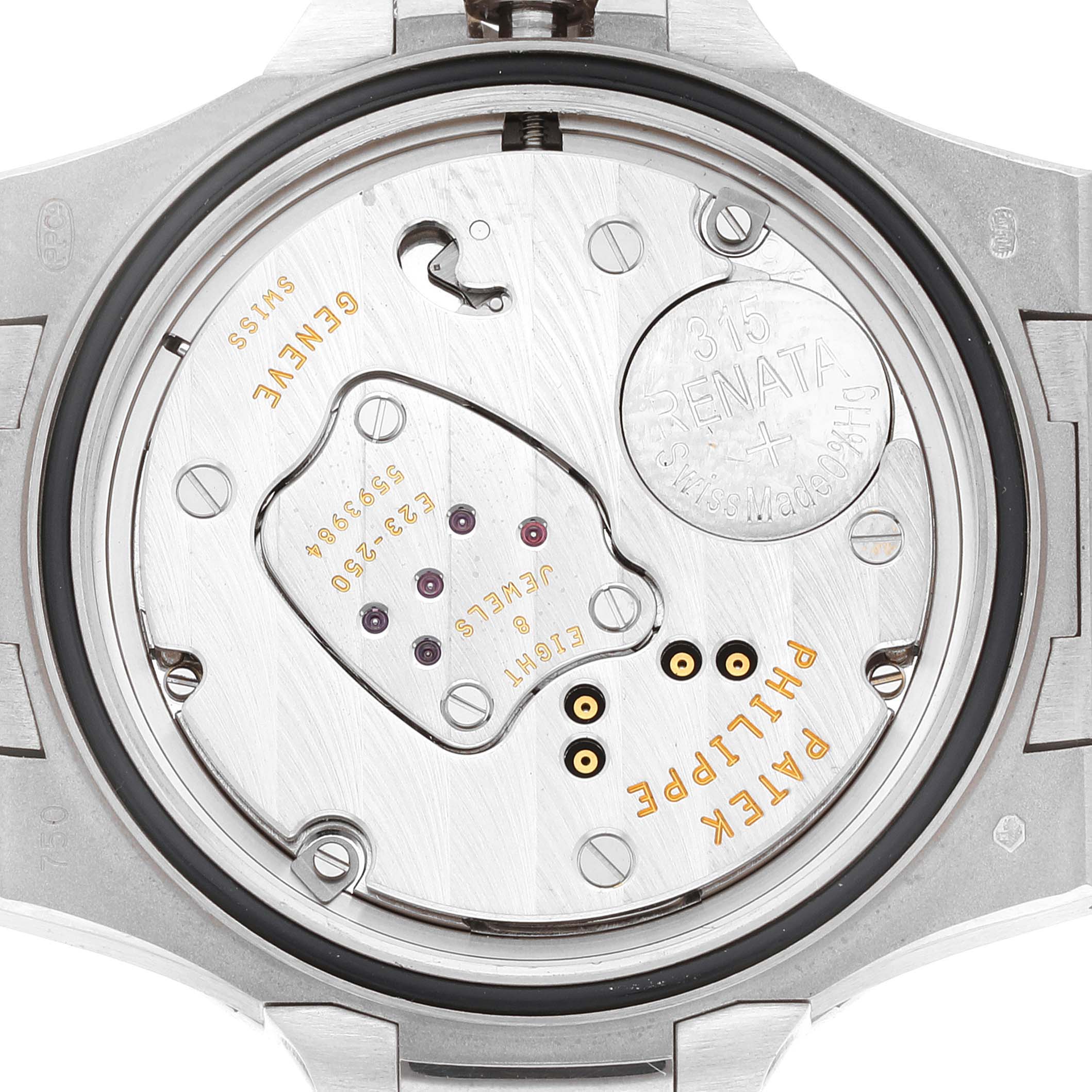 The image shows the back view of a Patek Philippe Nautilus 7010G Women's White Gold Silver Dial 7010G Women's White Gold Silver Dial watch, revealing its internal components and battery.