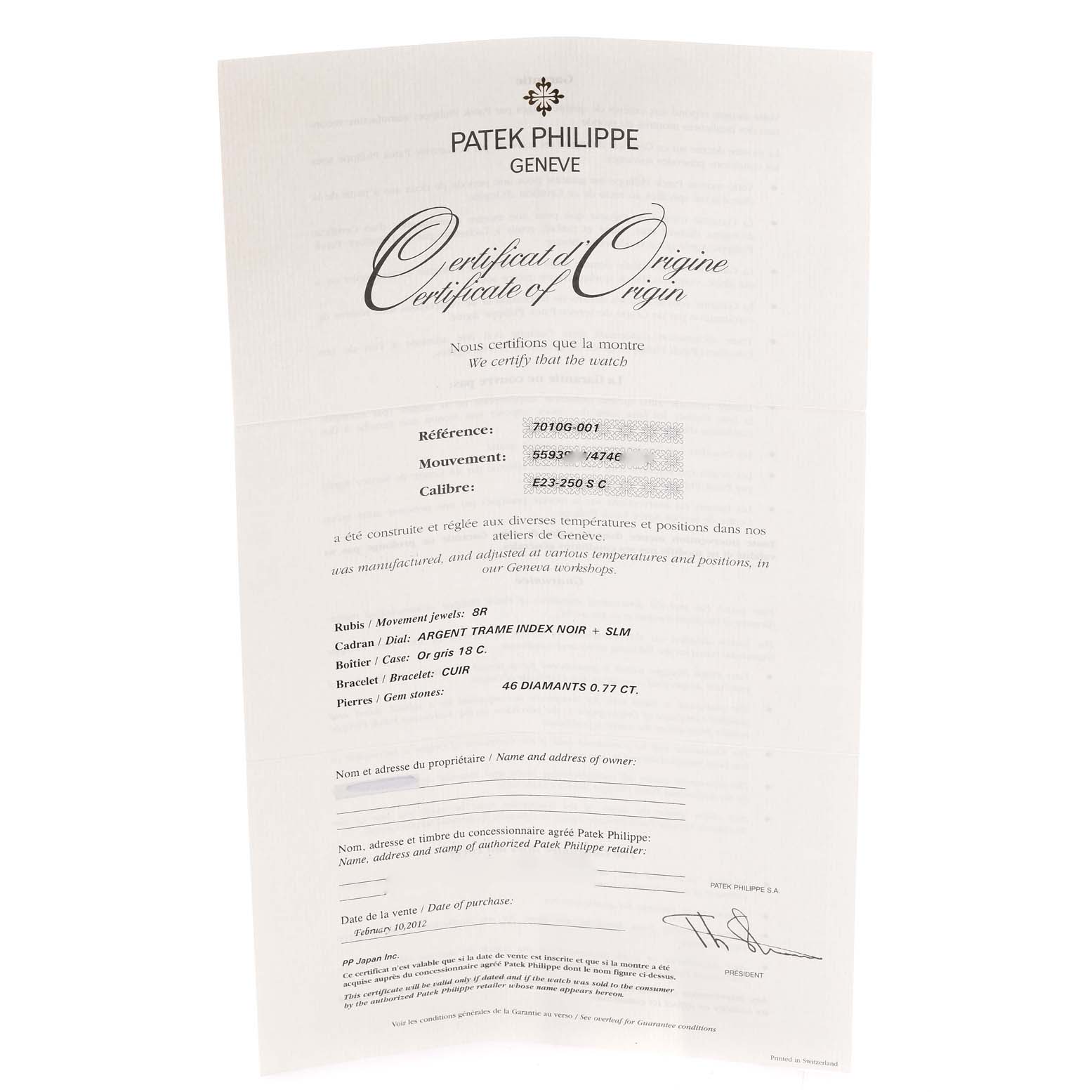 The image shows a Certificate of Origin for a Patek Philippe Nautilus 7010G Women's White Gold Silver Dial 7010G Women's White Gold Silver Dial watch, displayed at a slight angle.