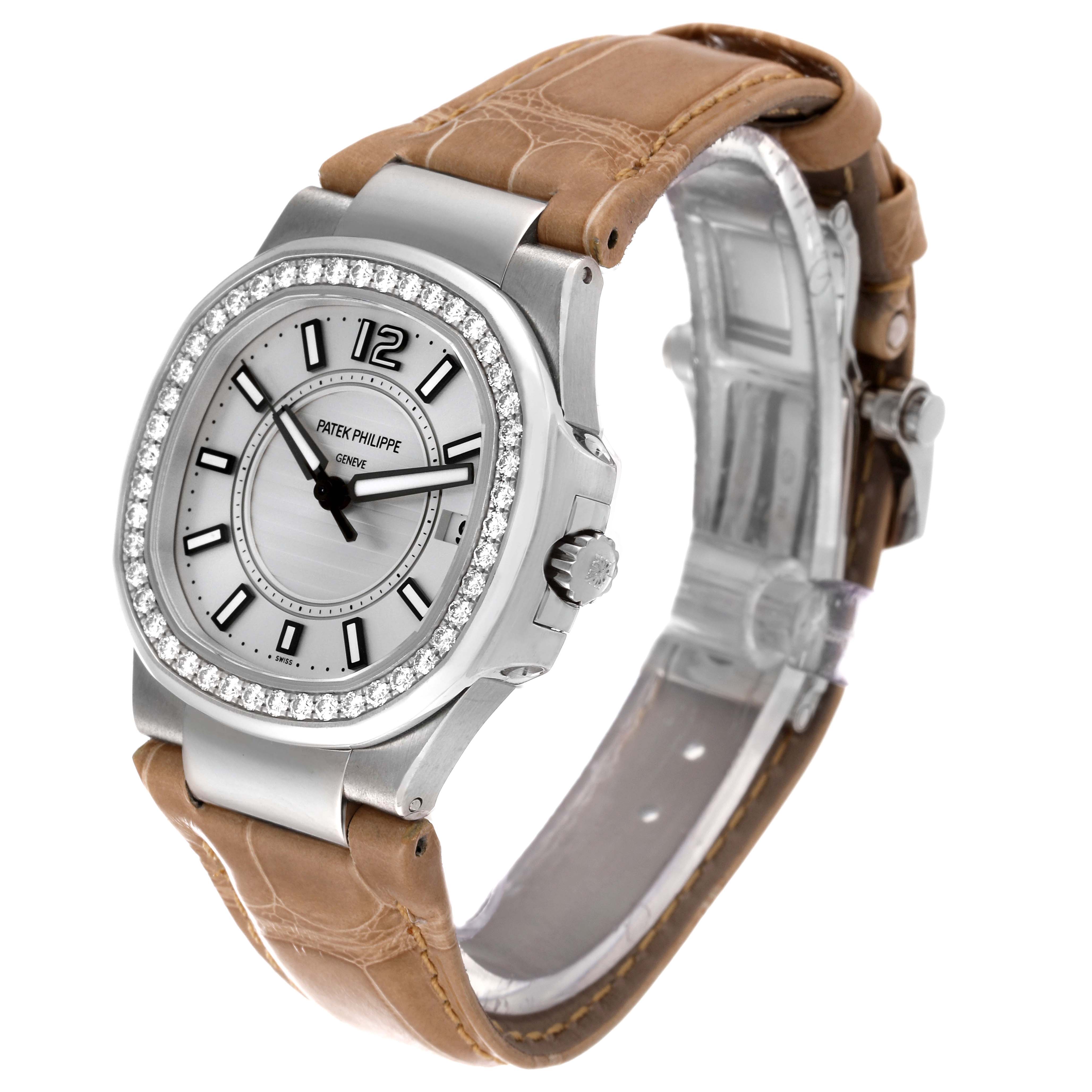 The image shows a Patek Philippe Nautilus 7010G Women's White Gold Silver Dial 7010G Women's White Gold Silver Dial watch from a three-quarter angle, displaying the face, bezel, crown, and leather strap.