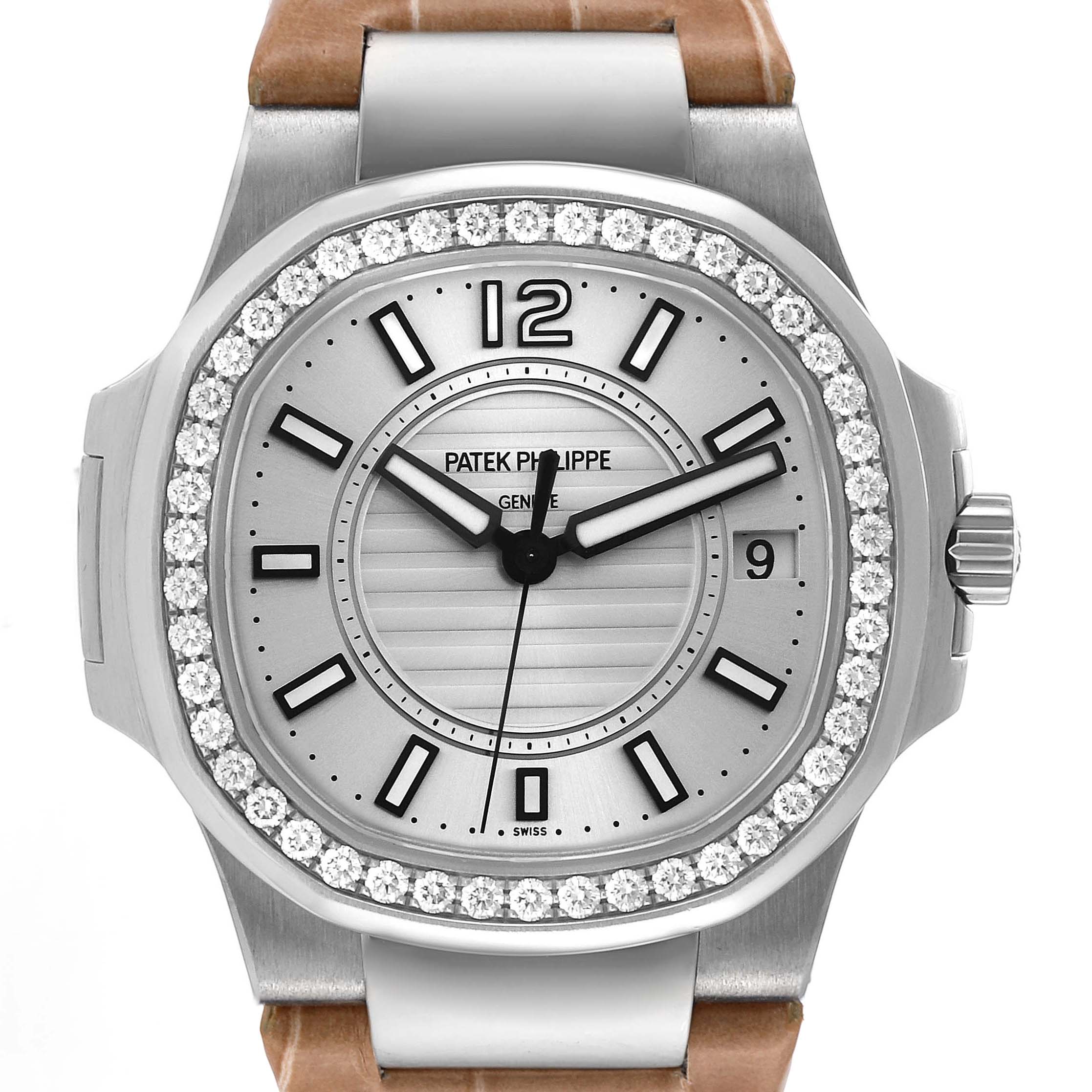 This is a frontal view of a Patek Philippe Nautilus 7010G Women's White Gold Silver Dial 7010G Women's White Gold Silver Dial watch showcasing the dial, bezel, hands, crown, and part of the strap.