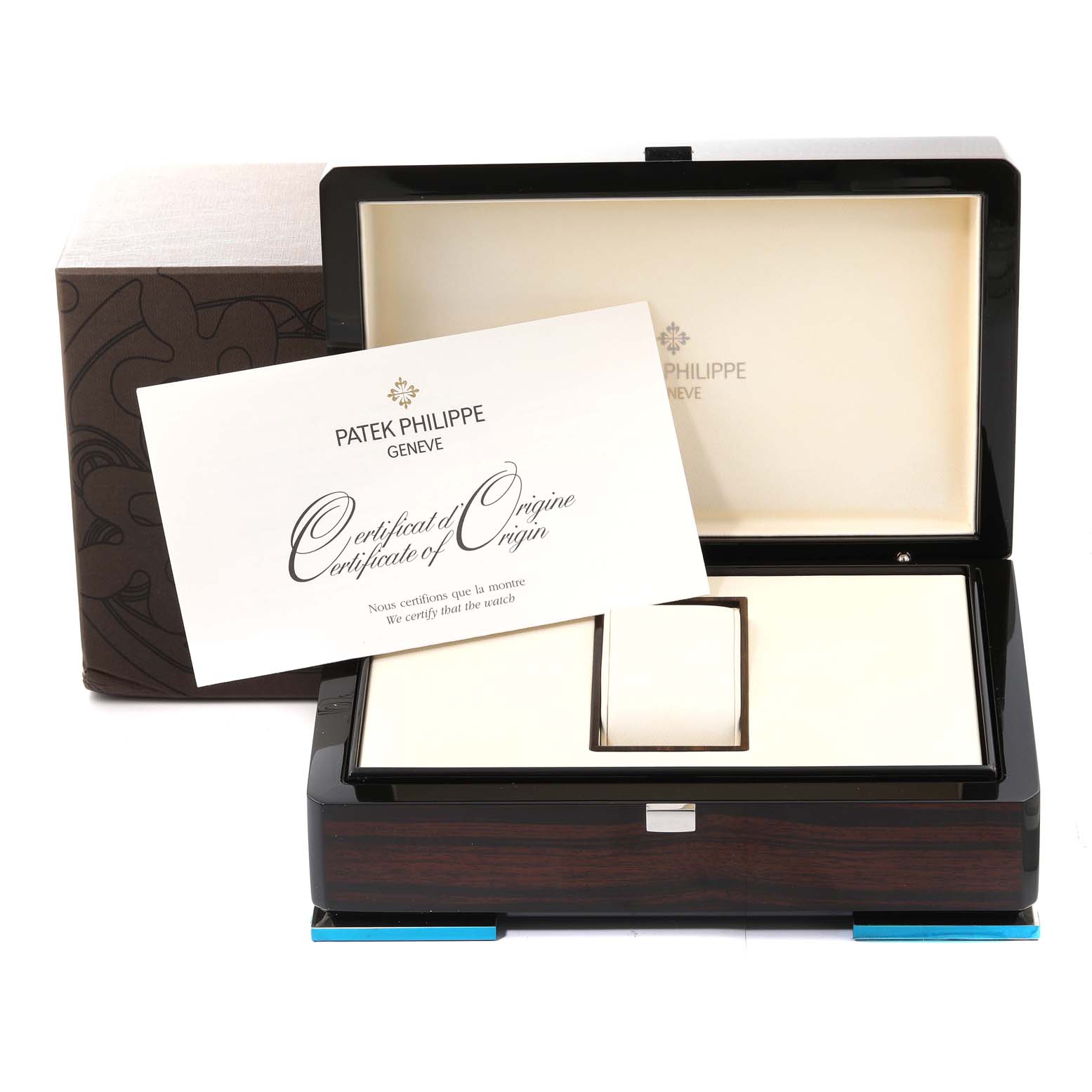 The image shows the packaging box and the certificate of origin for a Patek Philippe Nautilus 7010G Women's White Gold Silver Dial 7010G Women's White Gold Silver Dial watch.