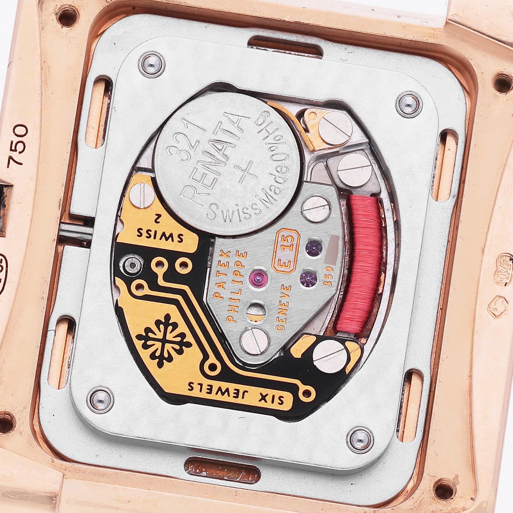 The image shows the movement of the Patek Philippe Twenty-4 4910/11R-011 Women's Rose Gold Silver Dial 4910/11R-011 Women's Rose Gold Silver Dial watch from the back, highlighting the battery and intricate components.