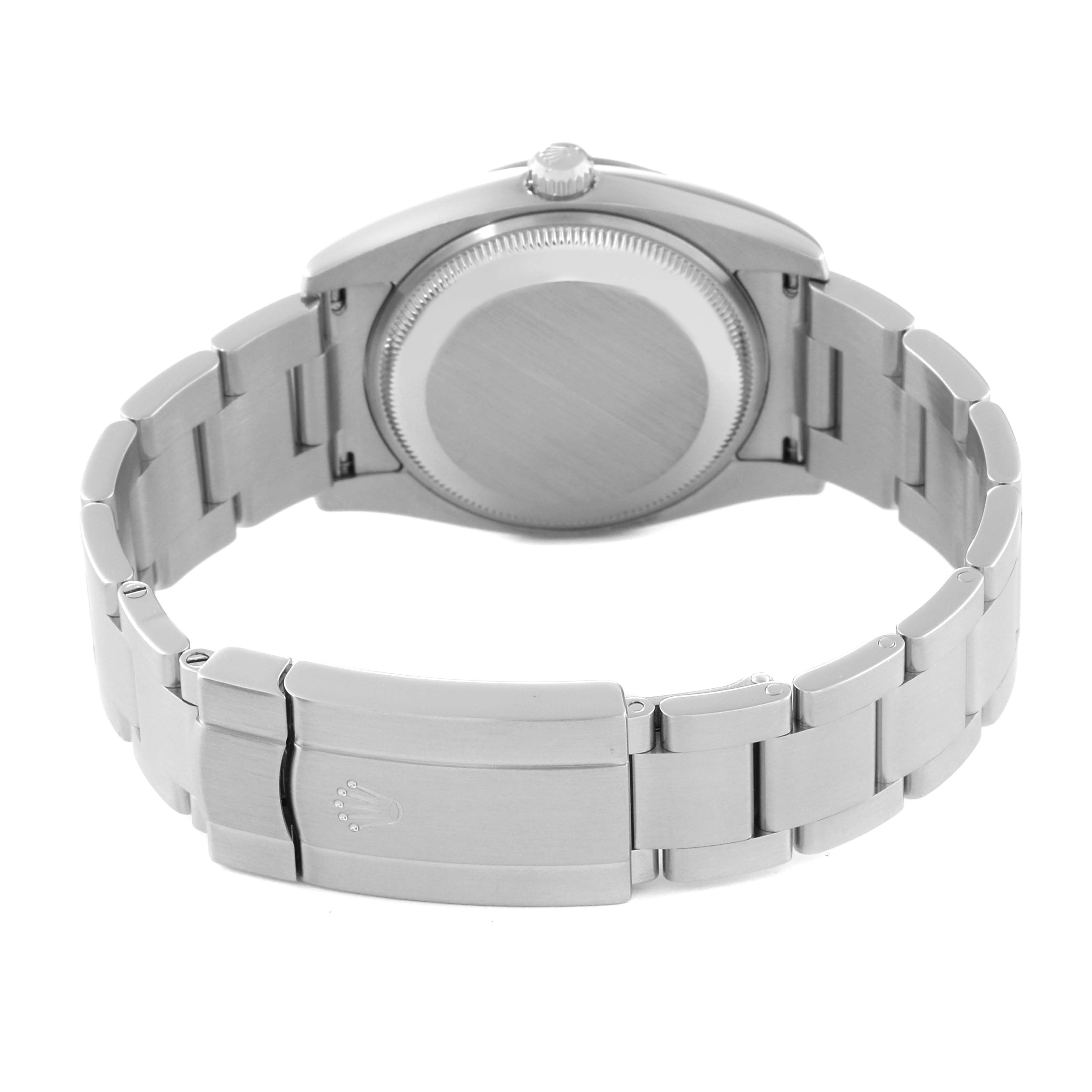 The Rolex Air-King 114210 Men's Stainless Steel Blue Dial 114210 Men's Stainless Steel Blue Dial watch is shown from the back, highlighting the case back, bracelet, and clasp.