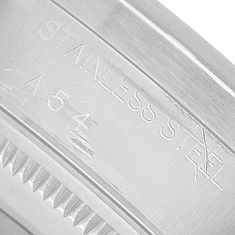 The image shows a close-up of the side engraving on a Rolex Air-King 14010 Men's Stainless Steel Blue Dial model, highlighting the "STAINLESS STEEL" text.