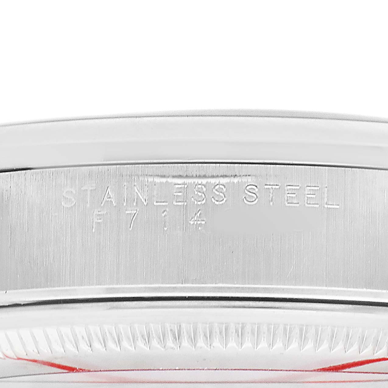 The image shows a close-up of the side of the Rolex Air-King 14000 Men's Stainless Steel Blue Dial watch case with "Stainless Steel" engraving.