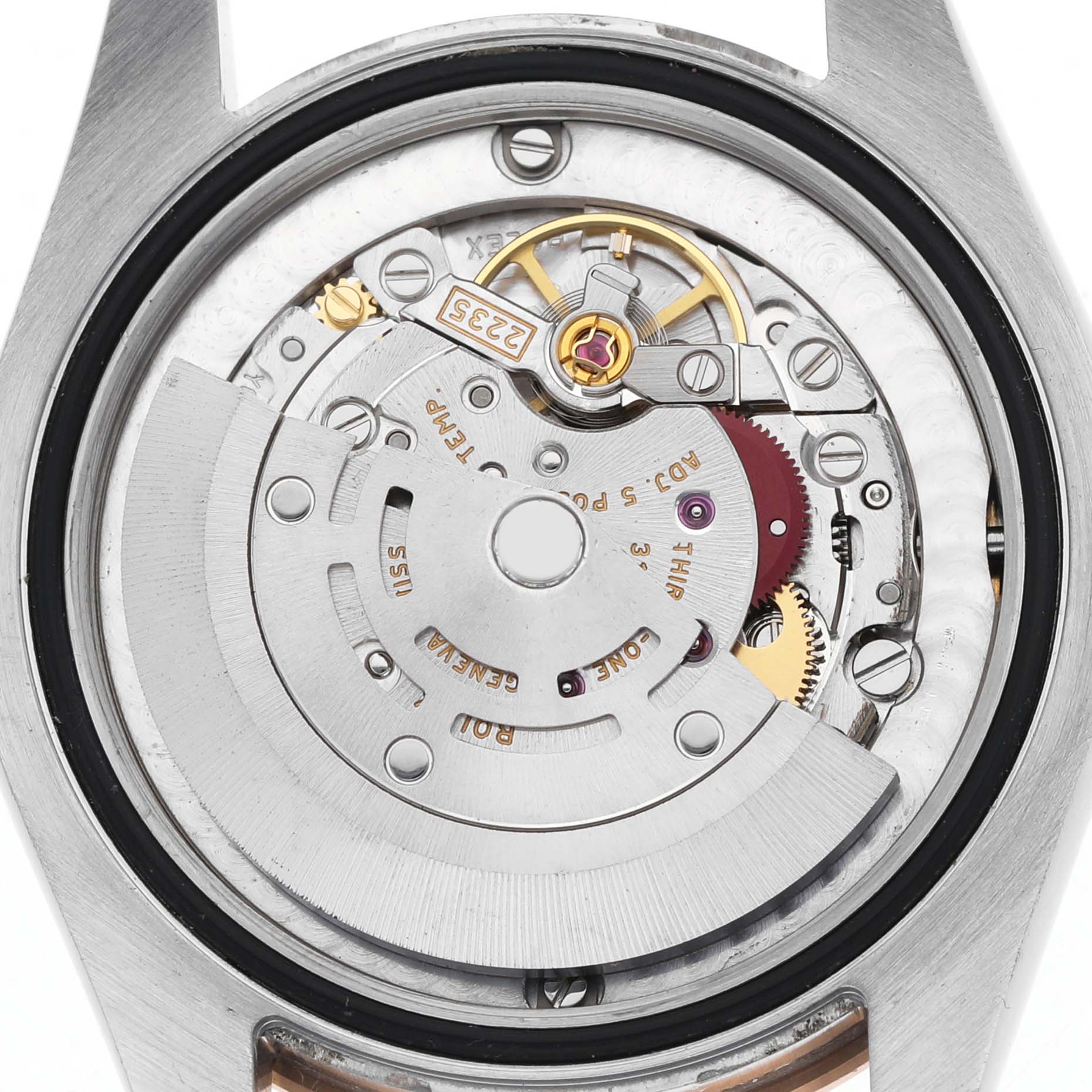The image shows the movement of a Rolex Mid-Size 178341 Women's Steel and Gold (two tone) Brown Dial watch from the back, displaying its intricate internal mechanics.
