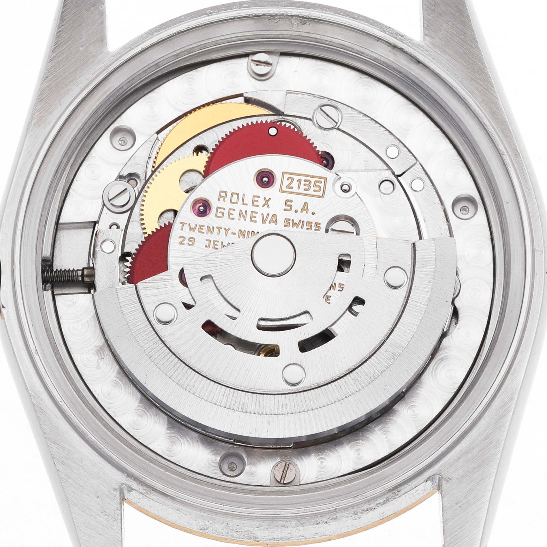 The image shows the movement of a Rolex Mid-Size 68273 Women's Steel and Gold (two tone) Champagne Dial model from the back, revealing gears and the automatic rotor.