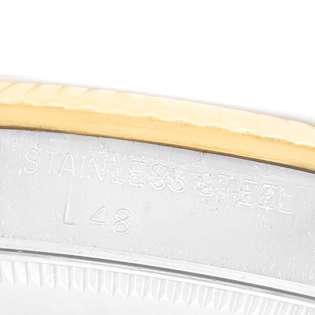 The image shows a close-up of the side of a Rolex Mid-Size 68273 Women's Steel and Gold (two tone) Champagne Dial watch, highlighting the stainless steel and gold bezel.