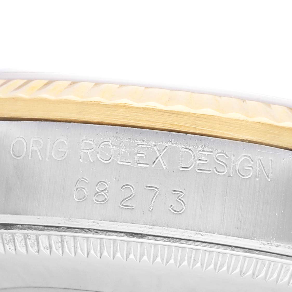 The image shows an angled view of the engraved side of the Rolex Mid-Size 68273 Women's Steel and Gold (two tone) Champagne Dial model, highlighting the model number '68273'.