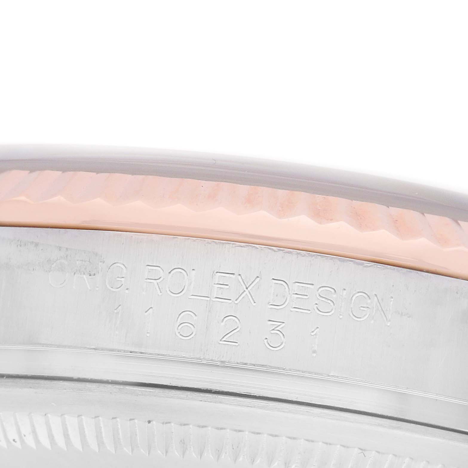 The image shows the engraved side of a Rolex Datejust 116231 Men's Steel and Gold (two tone) Black Dial 116231 Men's Steel and Gold (two tone) Black Dial, highlighting the serial and design numbers.