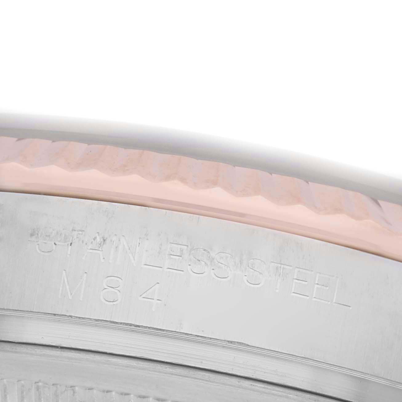 The image shows a close-up side angle of the Rolex Datejust 116231 Men's Steel and Gold (two tone) Black Dial 116231 Men's Steel and Gold (two tone) Black Dial watch, focusing on the engraved stainless steel part of the case.