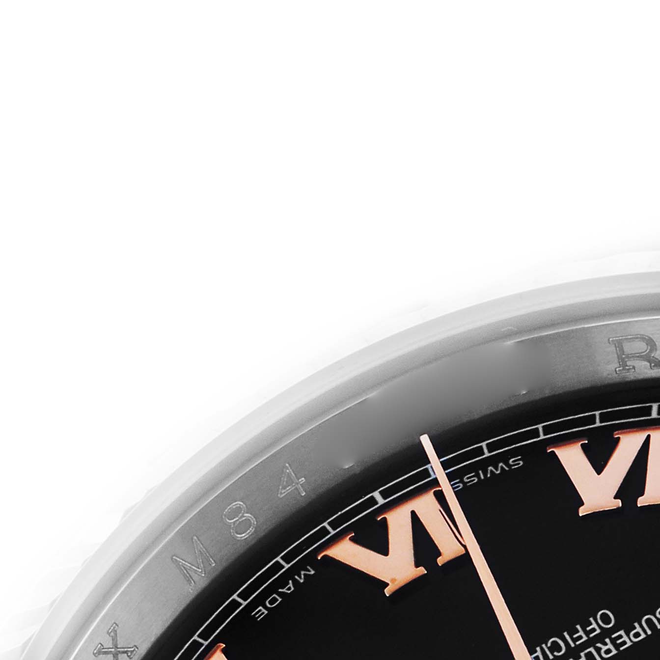 The image shows a close-up of a Rolex Datejust 116231 Men's Steel and Gold (two tone) Black Dial 116231 Men's Steel and Gold (two tone) Black Dial watch, highlighting the bezel and part of the dial with Roman numerals.