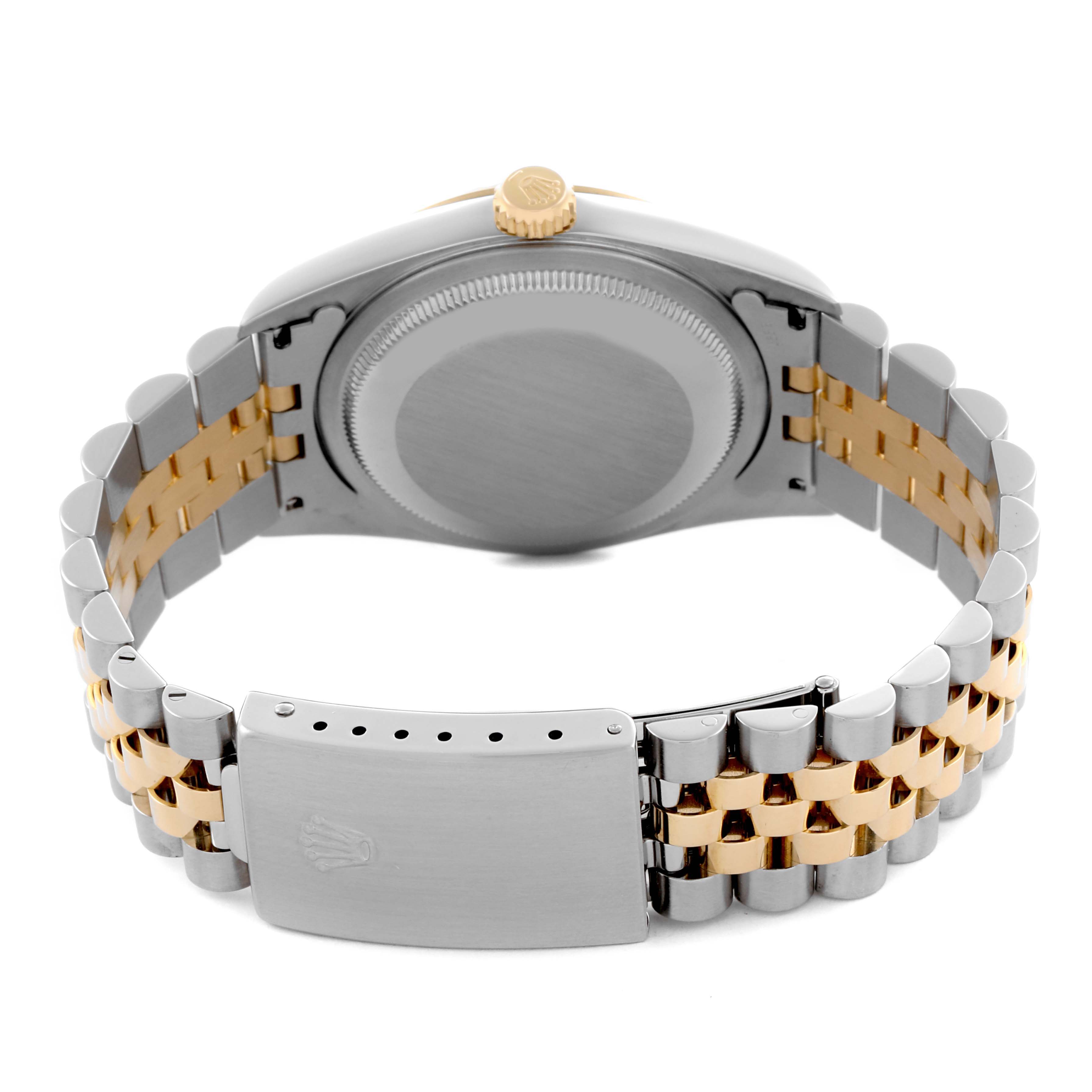 The image shows the back and clasp of a Rolex Datejust 16233 Men's Steel and Gold (two tone) Champagne Dial 16233 Men's Steel and Gold (two tone) Champagne Dial, focusing on its two-tone bracelet and caseback.