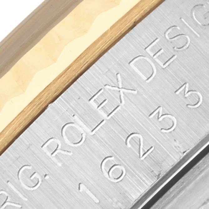 The image shows a close-up of the case side of a Rolex Datejust 16233 Men's Steel and Gold (two tone) Champagne Dial 16233 Men's Steel and Gold (two tone) Champagne Dial, focusing on the engraved text.