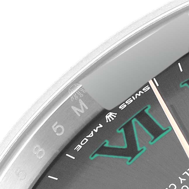 The image shows a close-up of the dial and part of the bezel of a Rolex Datejust 41 126301 Men's Steel and Gold (two tone) Grey Dial 126301 Men's Steel and Gold (two tone) Grey Dial watch, highlighting the "Swiss Made" text and Roman numerals.