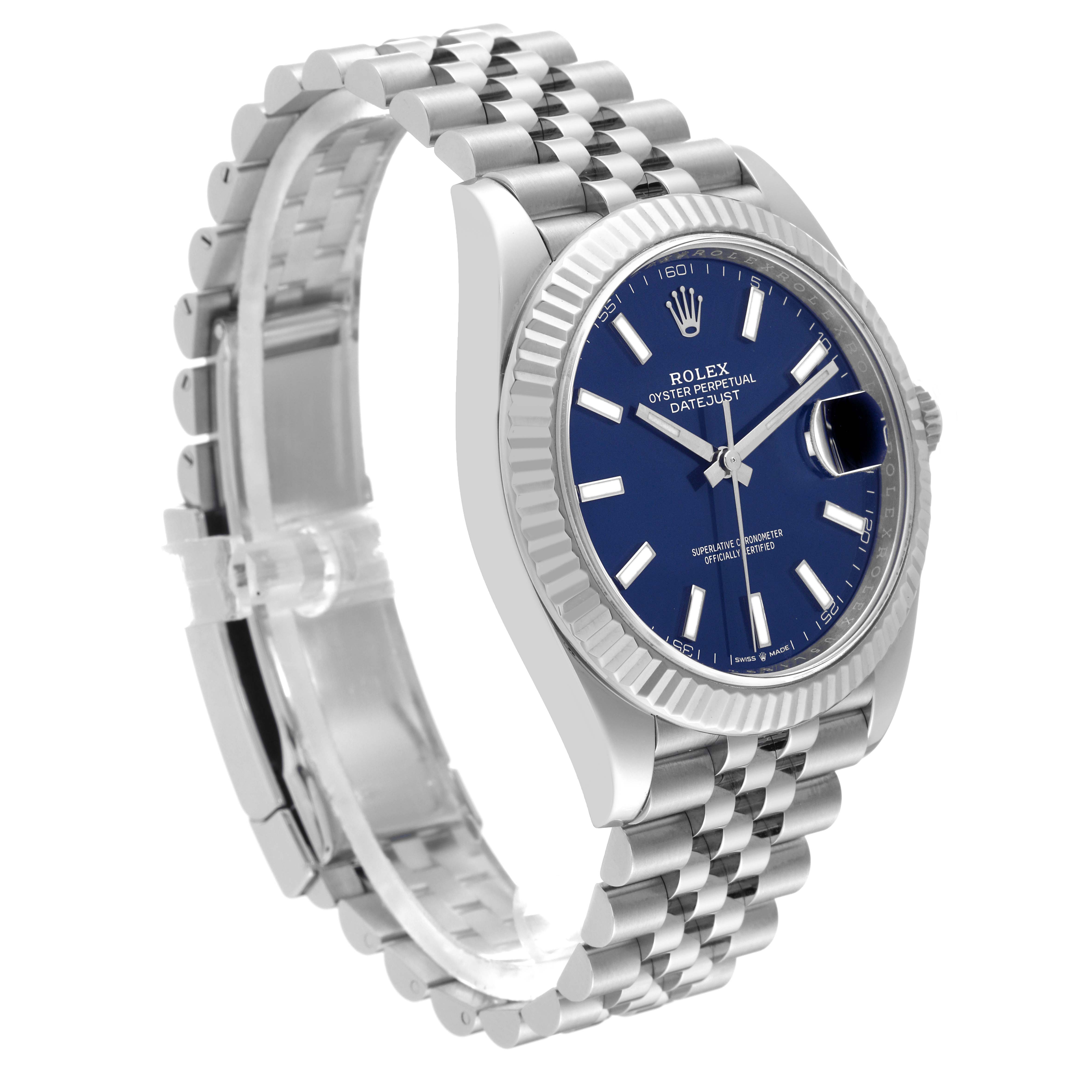The image shows a Rolex Datejust 41 126334 Men
s Stainless Steel Blue Dial 126334 Men
s Stainless Steel Blue Dial watch from a front-side angle, highlighting its blue dial, fluted bezel, and Jubilee bracelet.