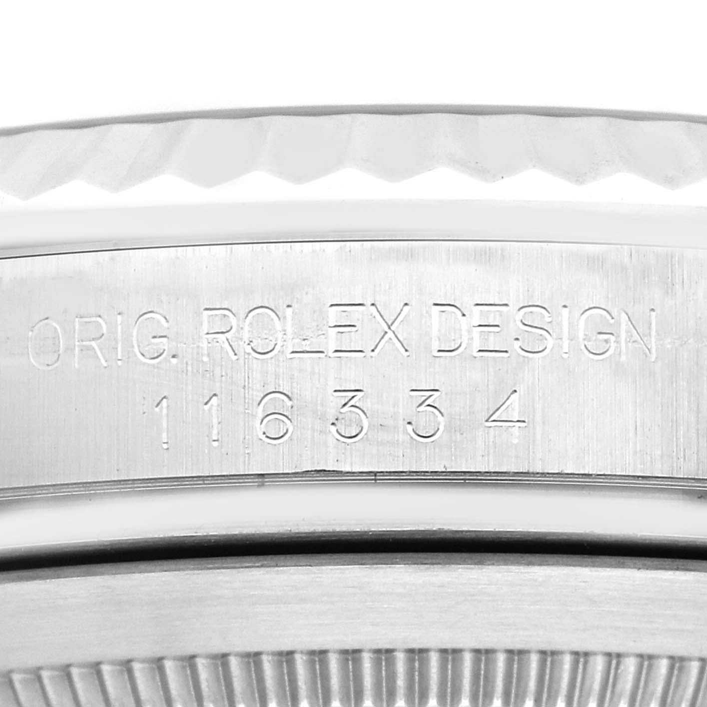 The image shows a close-up of the side of the bezel and serial number engraving on a Rolex Datejust 41 116334G Men
s Stainless Steel Grey Dial 116334G Men
s Stainless Steel Grey Dial watch.