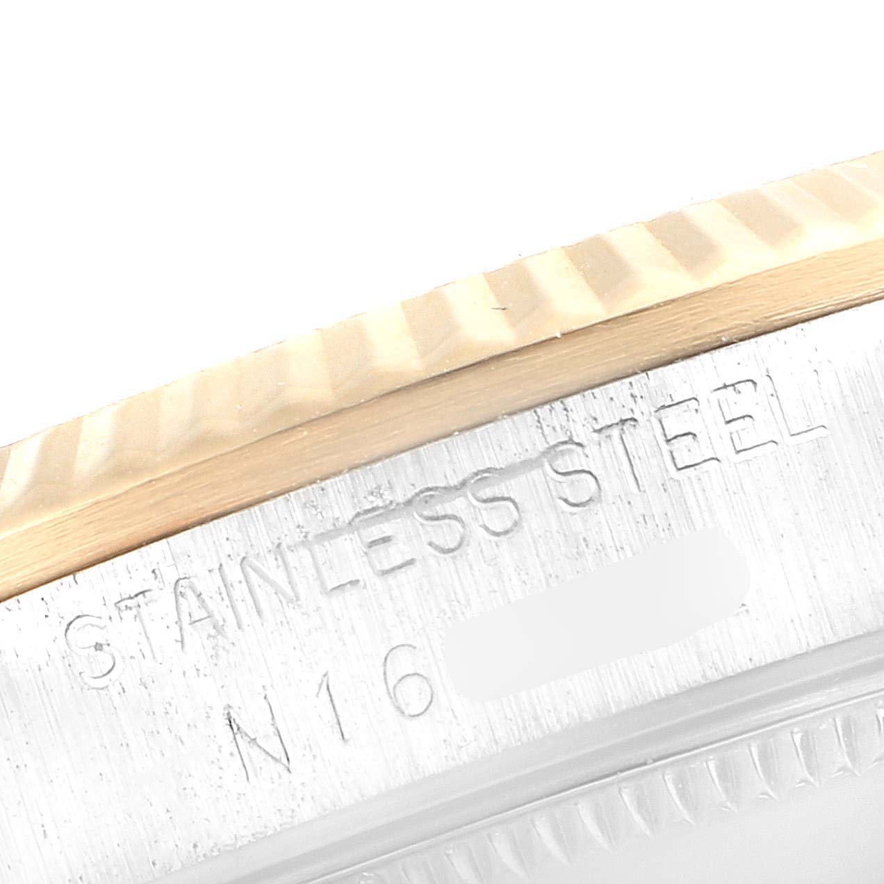 This image shows a close-up of the Rolex Mid-Size 68273 Women
s Steel and Gold (two tone) Black Dial 68273 Women
s Steel and Gold (two tone) Black Dial watch
s edge, highlighting its stainless steel case and bezel.