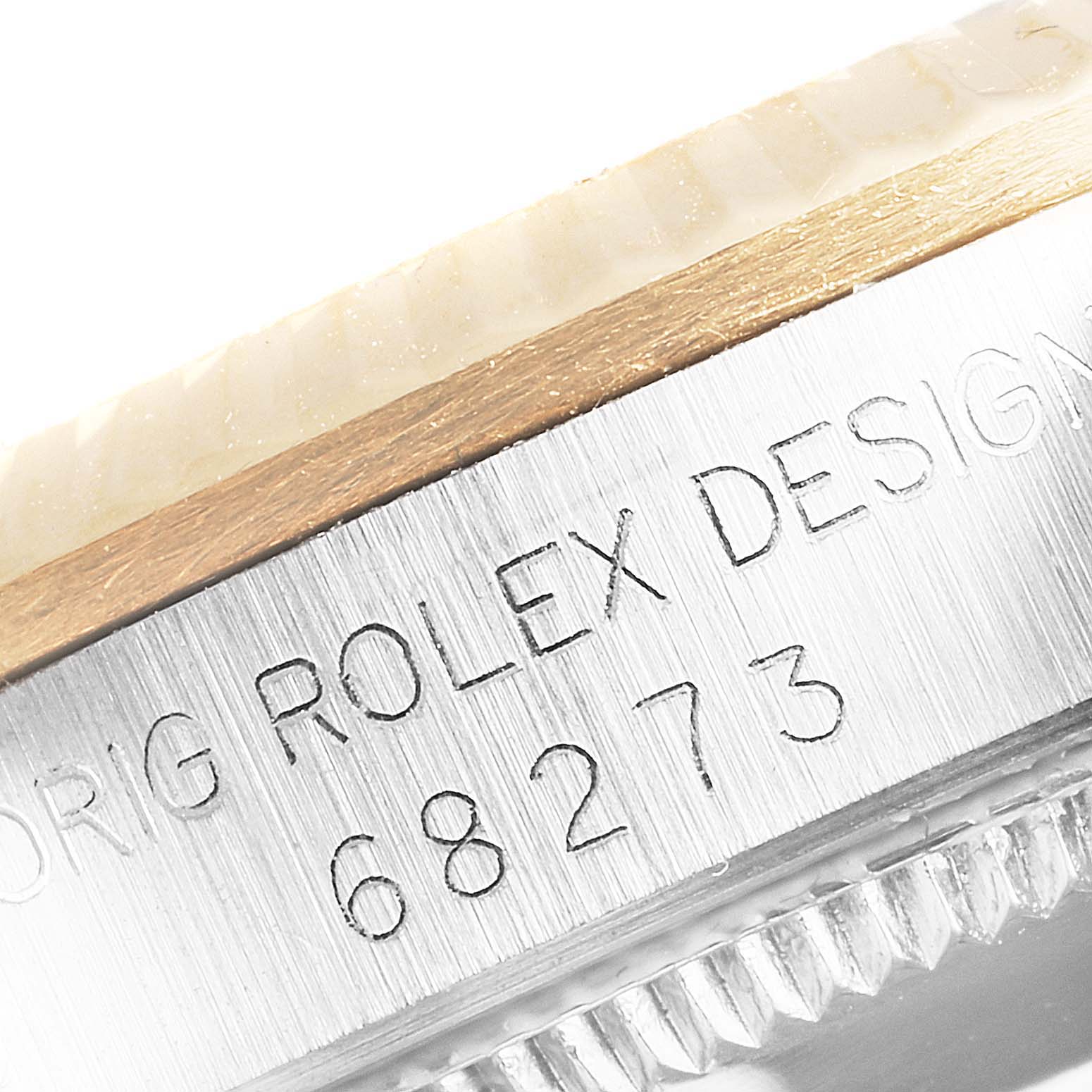 The close-up image shows the engraved model number and part of the bezel of a Mid-Size Rolex watch.