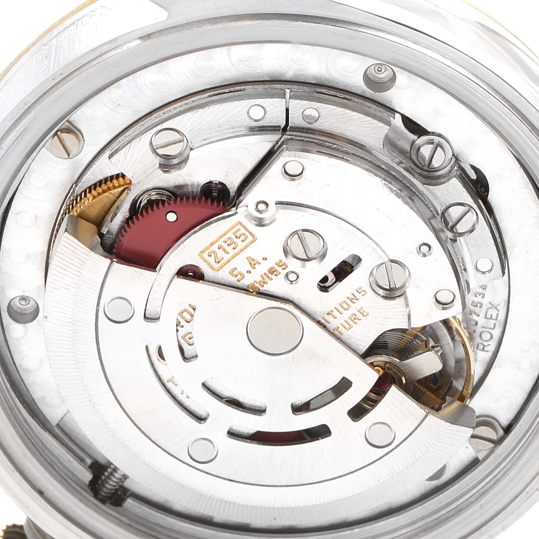 This image shows an internal view of the movement mechanism of a Rolex Mid-Size 68273 Women's Steel and Gold (two tone) Champagne Dial 68273 Women's Steel and Gold (two tone) Champagne Dial watch, highlighting gears and other components.