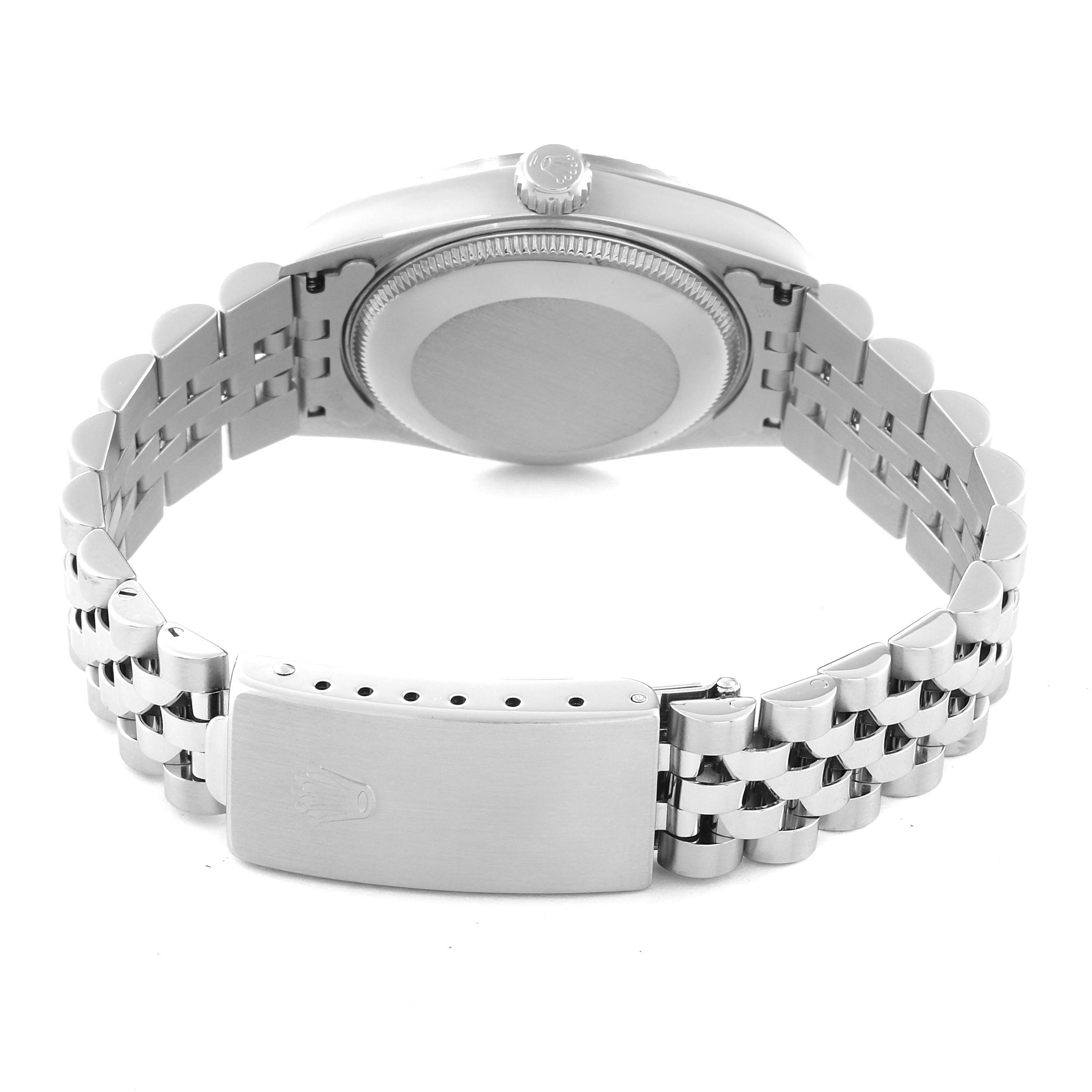 The image shows the back view of a Mid-Size Rolex watch highlighting the case, crown, bracelet, and clasp.