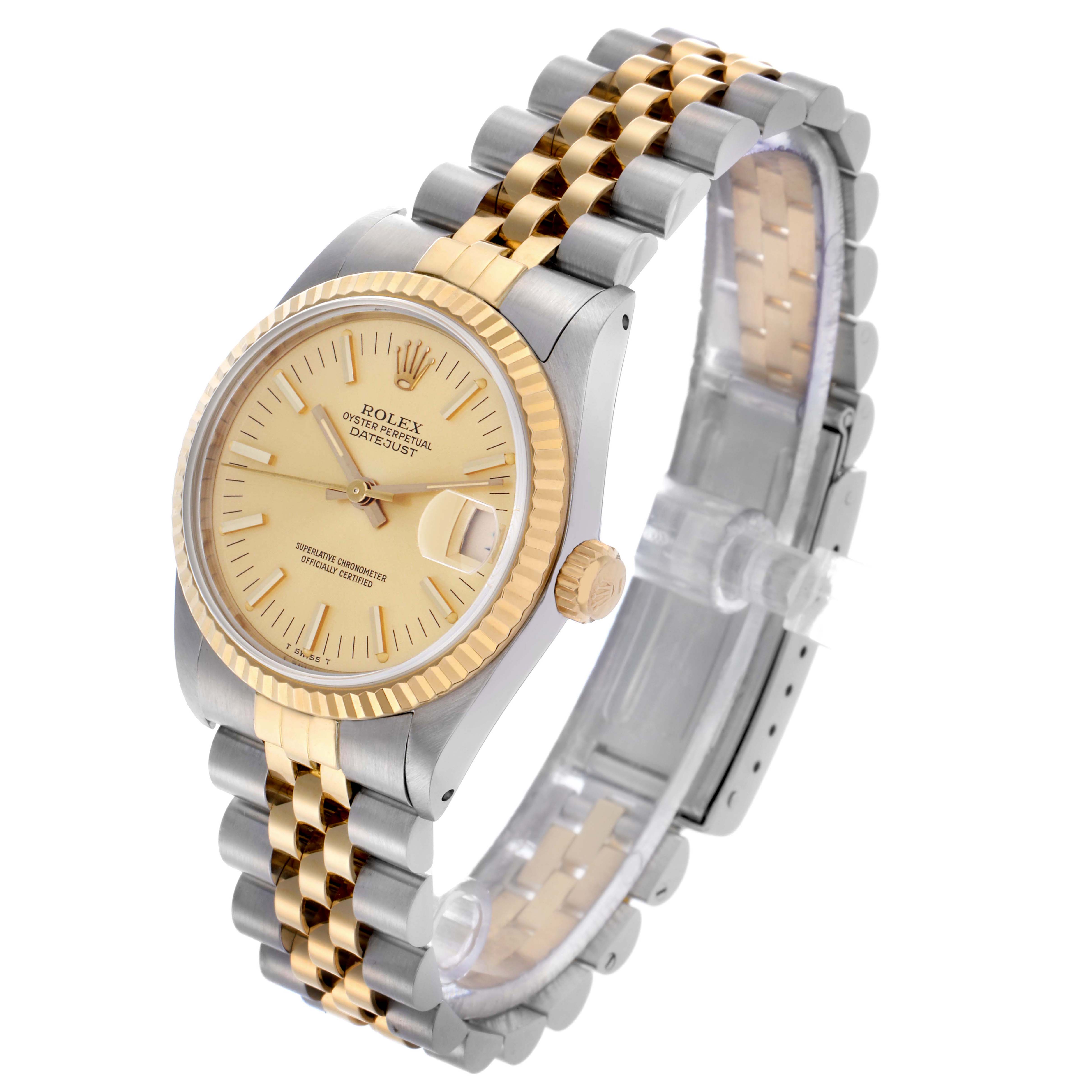 The Rolex Mid-Size 68273 Women's Steel and Gold (two tone) Champagne Dial 68273 Women's Steel and Gold (two tone) Champagne Dial watch is shown at an angle displaying the face, bezel, crown, and a two-tone bracelet.