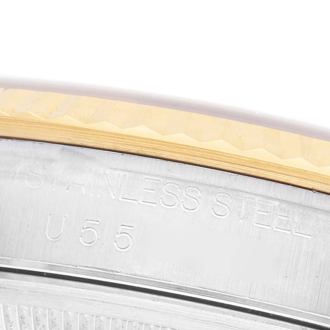 The image shows a close-up of the side of a Rolex Datejust 16233 Men's Steel and Gold (two tone) White Dial watch, highlighting the stainless steel and gold bezel.