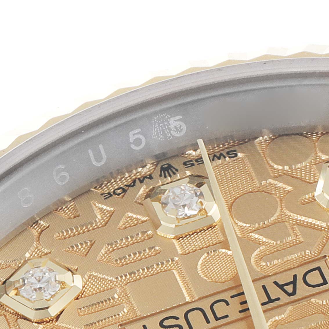 This image shows a close-up of the dial on a Rolex Datejust 126233 Men's Steel and Gold (two tone) Champagne Dial 126233 Men's Steel and Gold (two tone) Champagne Dial, highlighting the "SWISS MADE" mark, diamond hour markers, and part of the bezel.