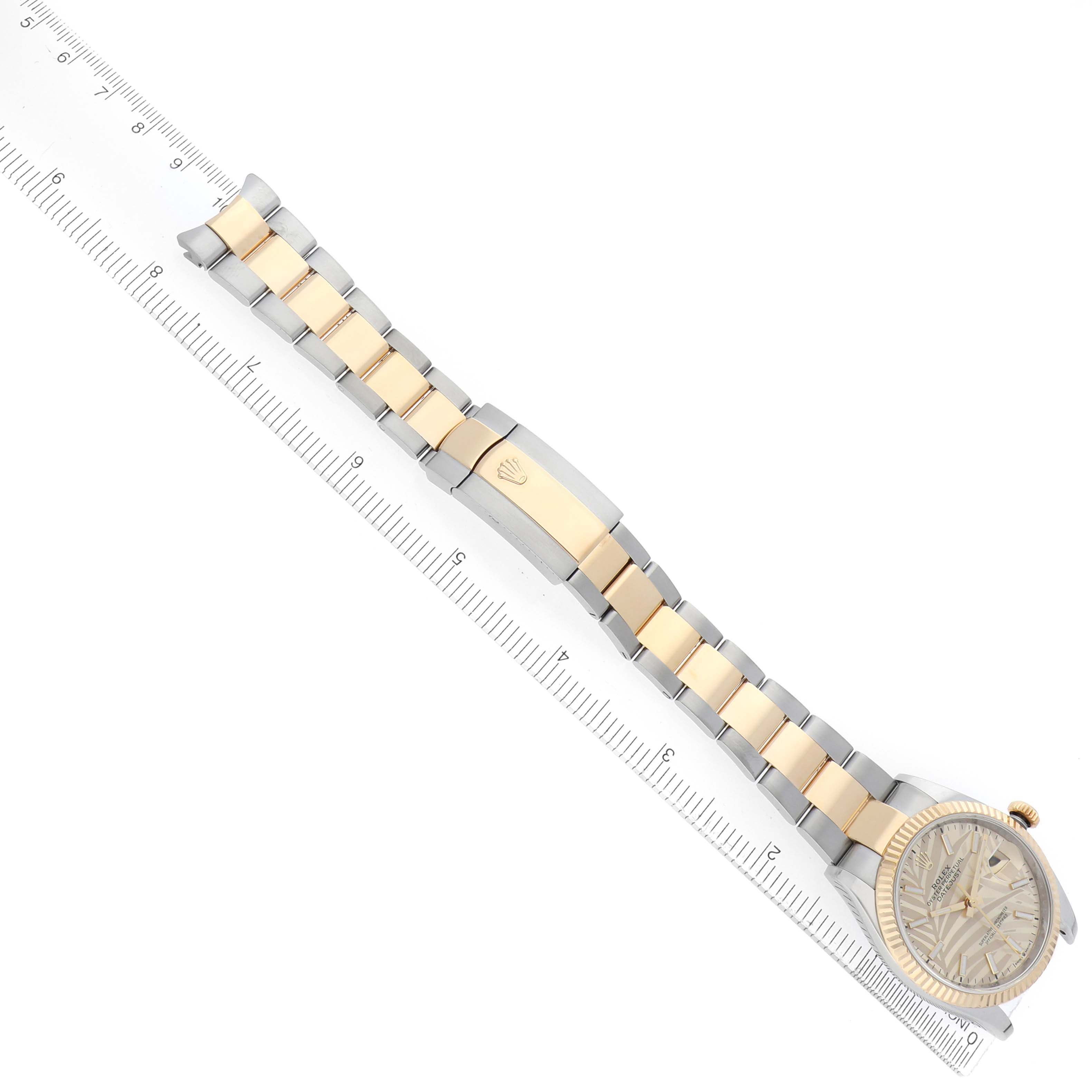 The Rolex Datejust 126233 Men's Steel and Gold (two tone) Champagne Dial watch is shown from a top view, highlighting the bracelet, clasp, and part of the watch face.
