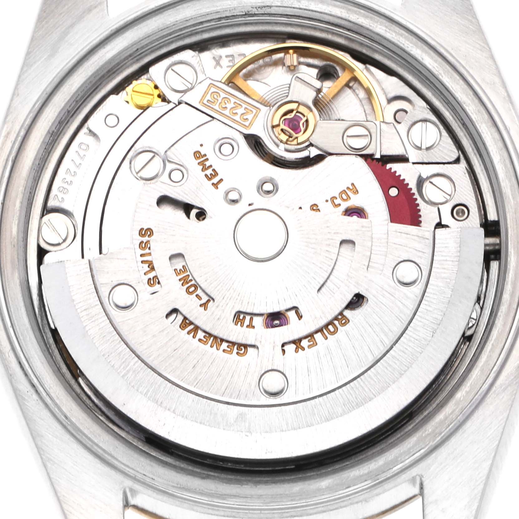 The image shows a close-up of the movement inside a Rolex Datejust 79173 Women's Steel and Gold (two tone) Champagne Dial 79173 Women's Steel and Gold (two tone) Champagne Dial watch, revealing its intricate mechanics and engravings.