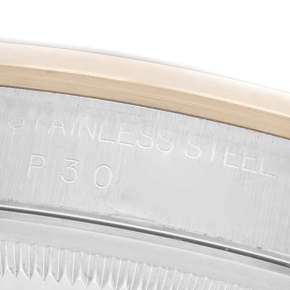 The image shows a close-up of the Rolex Datejust 16203 Men's Steel and Gold (two tone) Grey Dial 16203 Men's Steel and Gold (two tone) Grey Dial's case side, highlighting the bezel and engraved text.