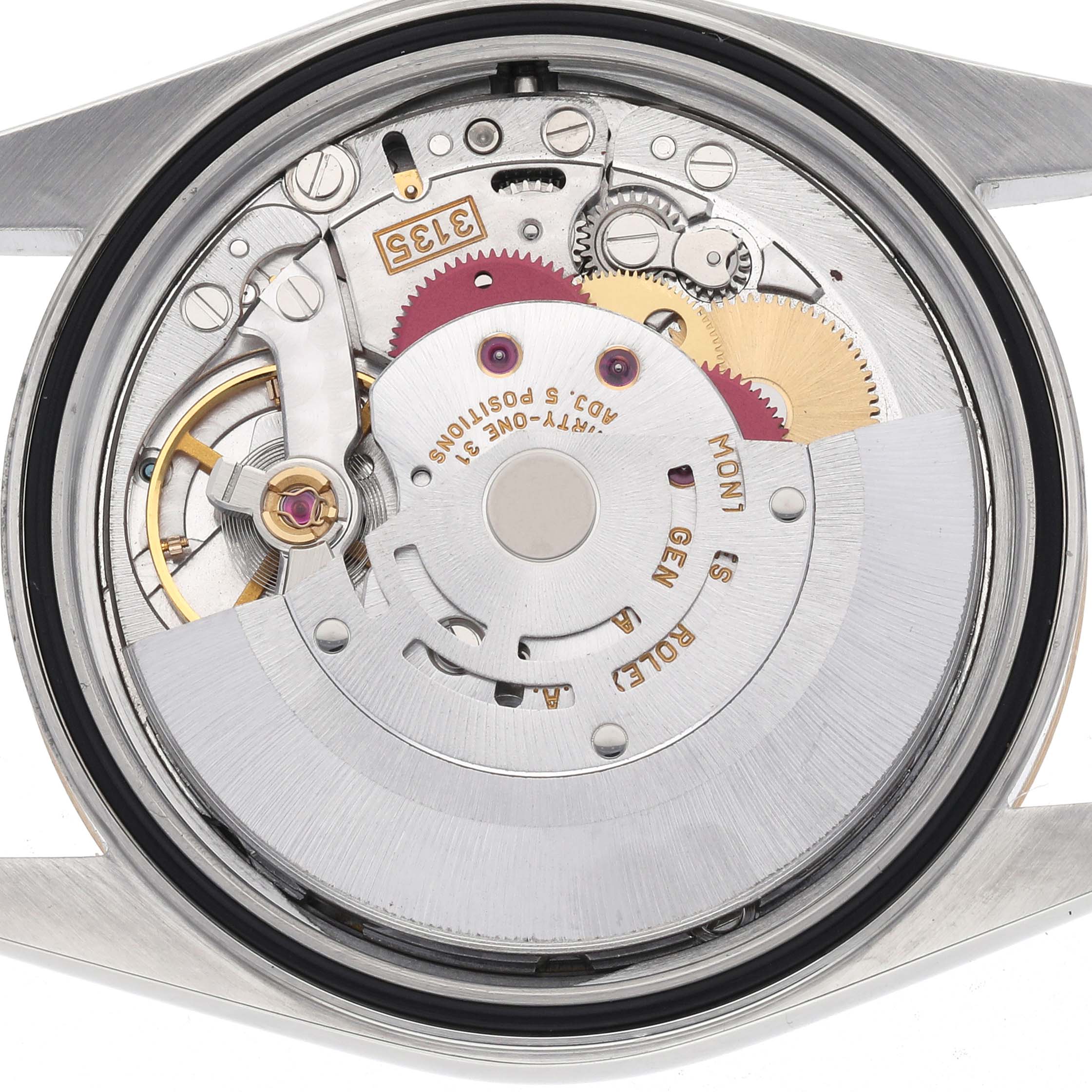 The image shows a top-down view of the Rolex Datejust 16203 Men's Steel and Gold (two tone) Grey Dial 16203 Men's Steel and Gold (two tone) Grey Dial movement, highlighting gears and rotor inside the case.
