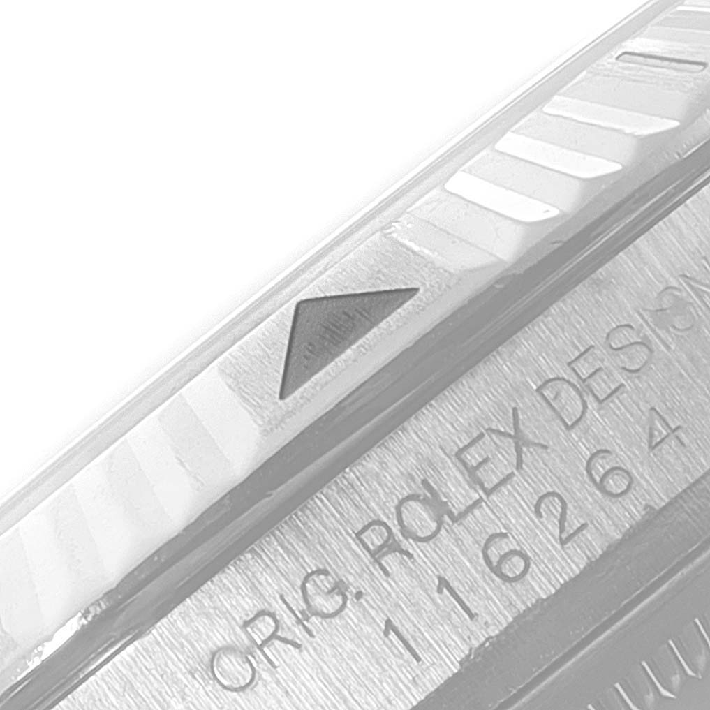 The image shows a close-up of the bezel and part of the inscription on the case of a Rolex Turn-o-Graph 116264 Men
s Stainless Steel Blue Dial 116264 Men
s Stainless Steel Blue Dial watch.
