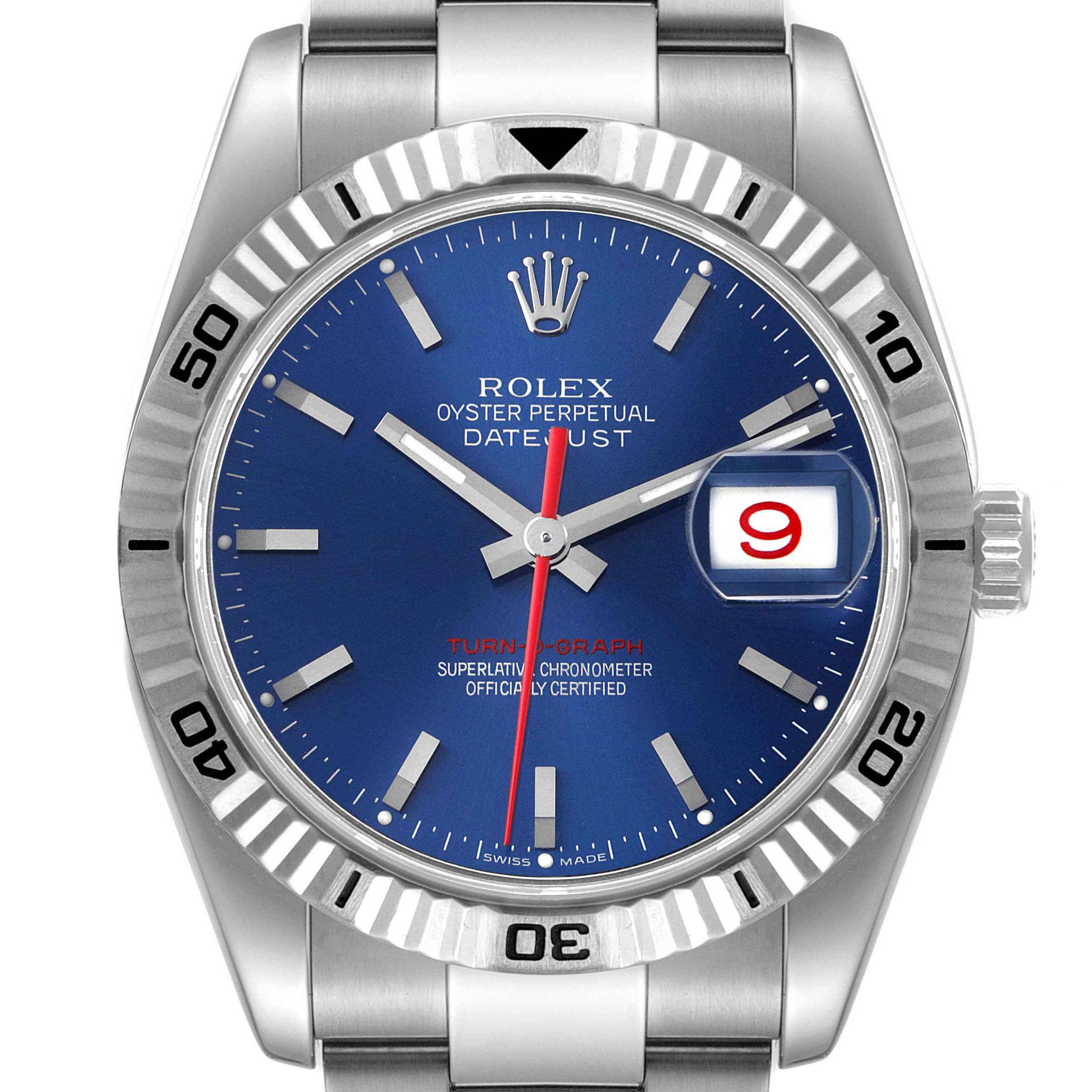 The image shows a Rolex Turn-o-Graph 116264 Men
s Stainless Steel Blue Dial 116264 Men
s Stainless Steel Blue Dial watch face, featuring a blue dial, fluted bezel with numerals, and a date window.
