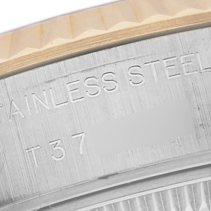 The image shows a close-up of the stainless steel case edge and bezel of a Rolex Datejust 69173 Women's Steel and Gold (two tone) White Dial 69173 Women's Steel and Gold (two tone) White Dial watch.