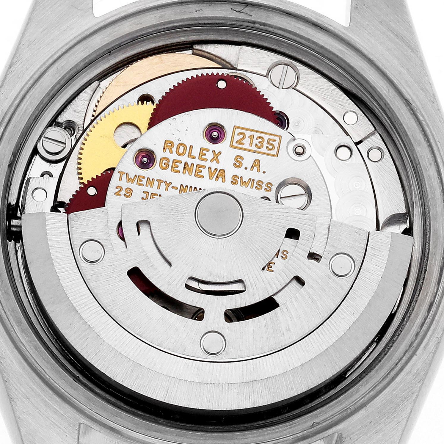 The image shows the intricate movement mechanism of a Rolex Datejust 69173 Women's Steel and Gold (two tone) White Dial 69173 Women's Steel and Gold (two tone) White Dial watch from a back angle, revealing gears and engravings.