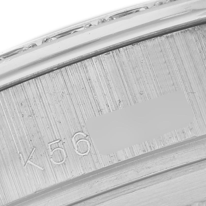 The image shows a close-up of the serial number engraving on the Rolex Pearlmaster 18946 Men's Platinum Mother of Pearl Dial 18946 Men's Platinum Mother of Pearl Dial's inner bezel.