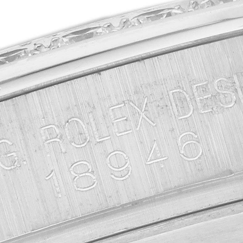 The image shows a close-up view of the engraving on the bezel of a Rolex Pearlmaster 18946 Men's Platinum Mother of Pearl Dial 18946 Men's Platinum Mother of Pearl Dial watch.