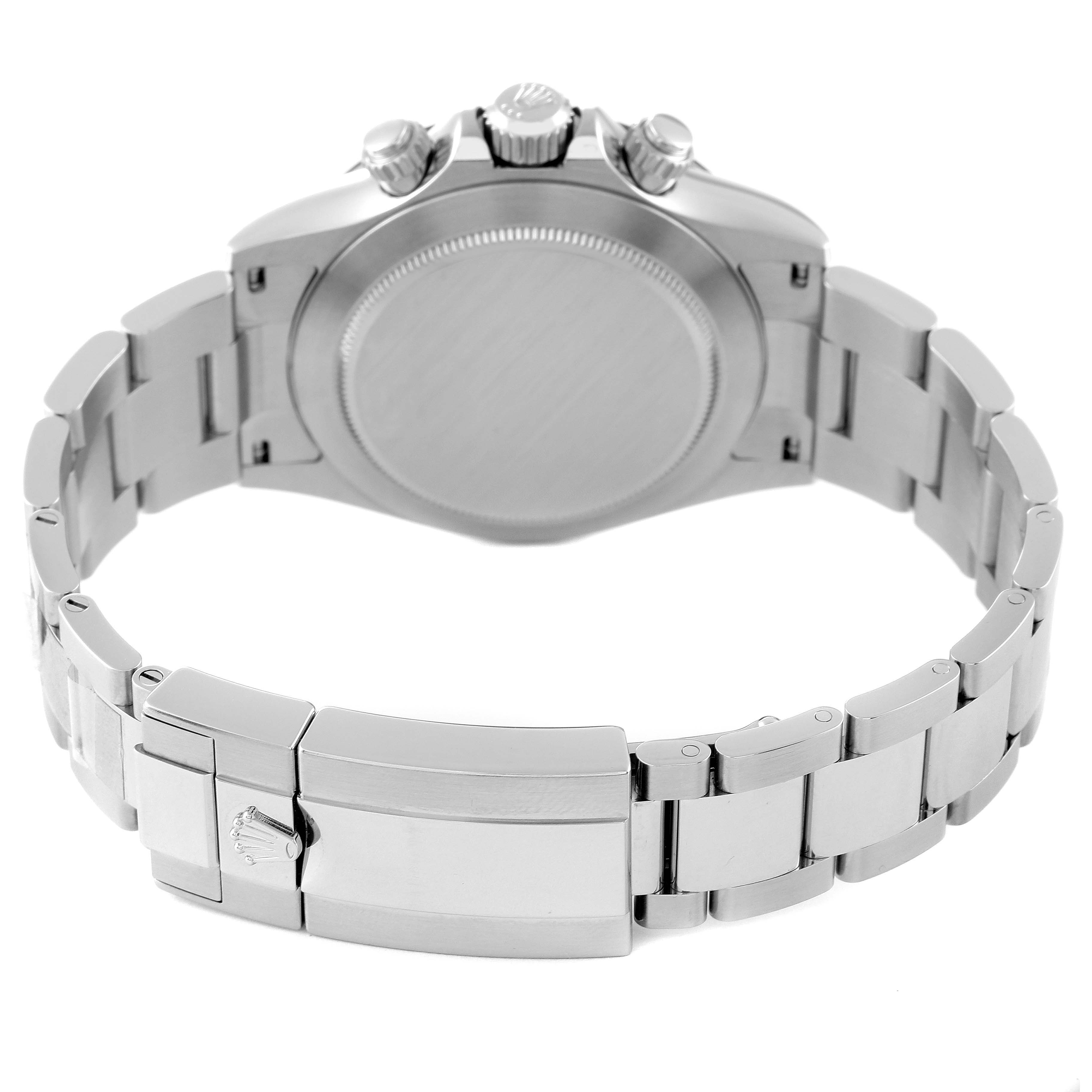 The image shows the back side of a Rolex Daytona 116500 Men
s Stainless Steel White Dial 116500 Men
s Stainless Steel White Dial watch, focusing on the clasp, bracelet, and case back.